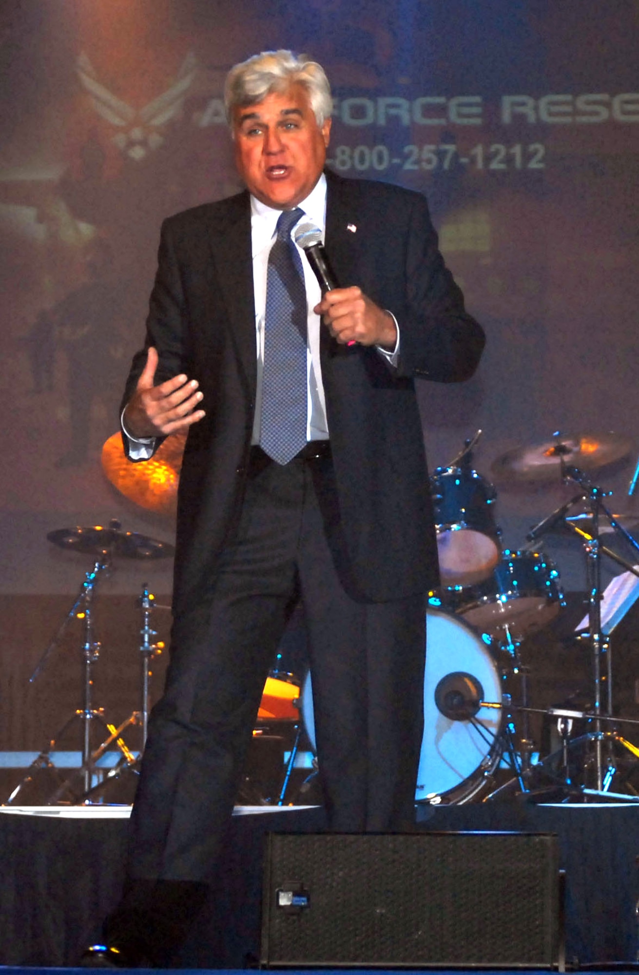 Comedian Jay Leno tears down the house during his performance in Hangar 4 at McChord Field, Wash., May 7. The show was a "Get One Now" event, which is the series Air Force Reserve Recruiting Service arranges celebrity visits, which are intended to promote retention in the Reserve and morale for troops in all services and components. This was one of Leno's many stops during his Tour for the Troops, an event sponsored by Air Force Reserve Recruiting. (U.S. Army photo by Spc. Jarrett Branch/Released)
