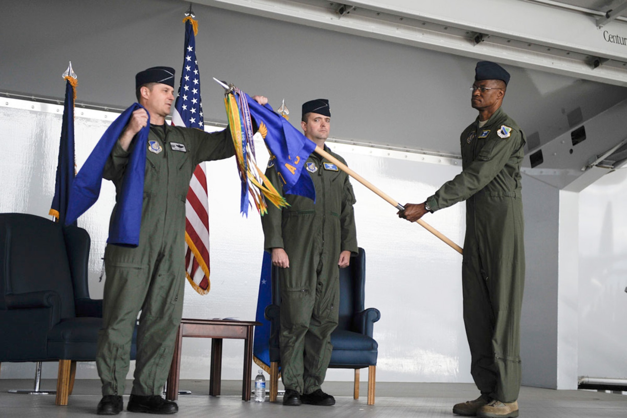 Col. William Routt unfurls the 537th Airlift Squadron guidon, held by Senior Master Sgt. Steve Vaughn, as Lt. Col. Thomas McGee looks on April 29, 2011 during the unit's activation ceremony at Joint Base Elmendorf-Richardson, Alaska. Colonel Routt is the 3rd Operations Group commander, and Colonel McGee is the 537th AS commander. (U.S. Air Force photo\Steve White) 