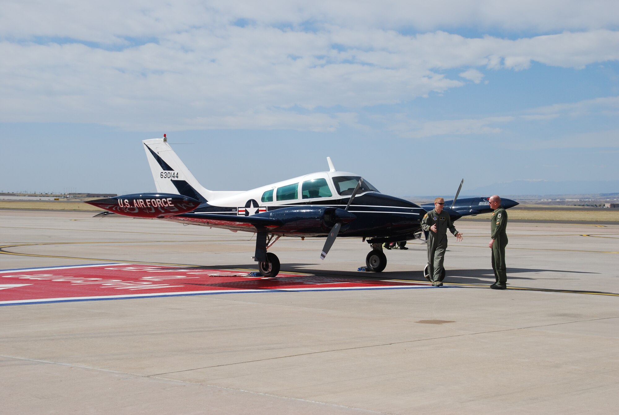 Chaplain (Maj.) Buddy Walker and Lt. Col. Troy Endicott preflight Chaplain Walker’s Cessna for Colonel Endicott’s final flight April 29, 2011. Colonel Endicott is the outgoing 21st Operations Support Squadron commander. (U.S. Air Force photo/Rollan Yocum)