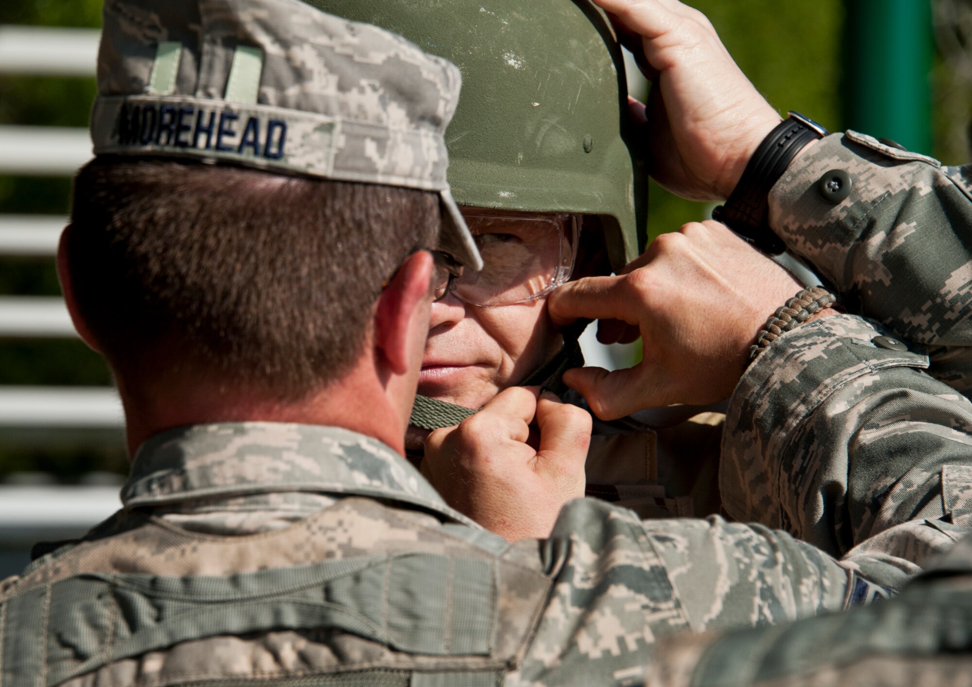 Chief Master Sgt. of the Air Force James A. Roy dons his helmet before taking a ride in the humvee roll-over simulator during his tour of the 96th Ground Combat Training Squadron’s training area at Eglin Air Force Base, Fla., May 6.  During the simulation, the chief flipped three times before the vehicle stopped.  Then he and his team had to climb out while the vehicle was still upside down.  The chief also received other hands-on “Brave Defender” experience with the 96th GCTS, firing weapons, watching demonstrations and driving a humvee through a village with simulated improvised explosive devices.  (U.S. Air Force photo/Samuel King Jr.)