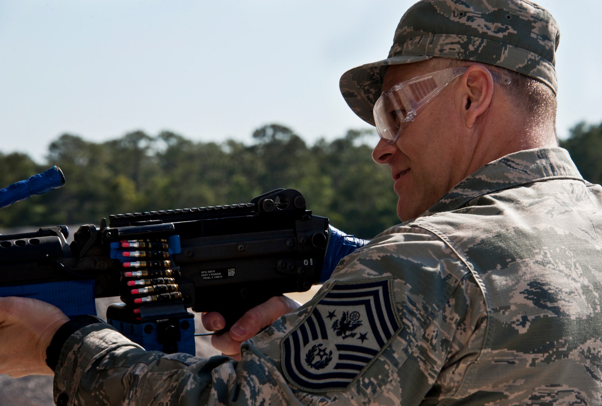 Chief Master Sgt. of the Air Force James A. Roy takes aim at a target inside a building with a “simunition” loaded M-249 during his tour of the 96th Ground Combat Training Squadron’s training area at Eglin Air Force Base, Fla., May 6.  The chief received a hands-on “Brave Defender” experience with the 96th GCTS, firing weapons, watching demonstrations and driving a humvee through a village with simulated improvised explosive devices.  (U.S. Air Force photo/Samuel King Jr.)