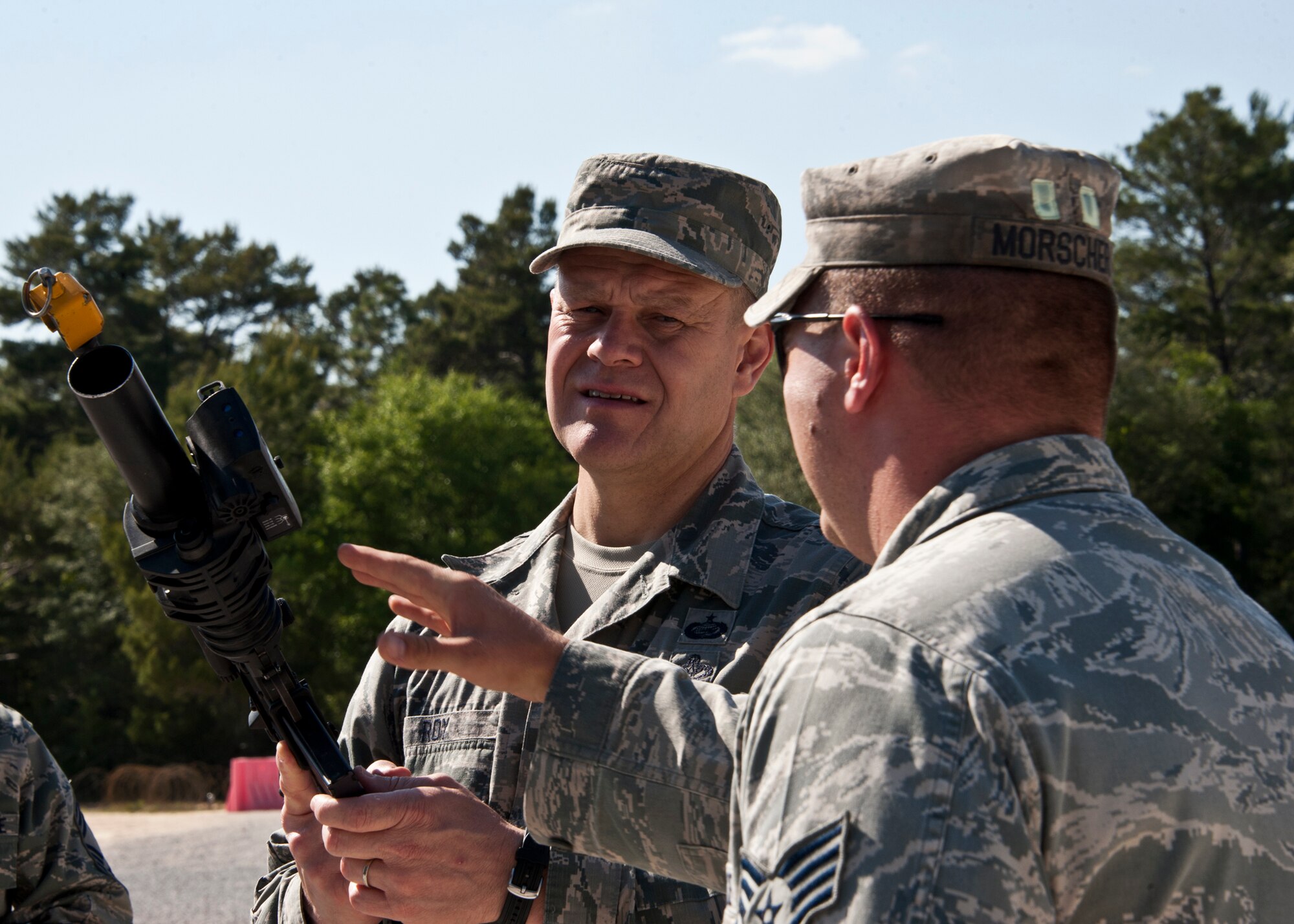 Staff Sgt. Ivan Morscher, 96th Ground Combat Training Squadron, briefs Chief Master Sgt. of the Air Force James A. Roy on a specially equipped M-4 during his tour of the squadron at Eglin Air Force Base, Fla., May 6.  The chief received a hands-on “Brave Defender” experience with the 96th GCTS, firing weapons, watching demonstrations and driving a humvee through a village with simulated improvised explosive devices.  (U.S. Air Force photo/Samuel King Jr.)