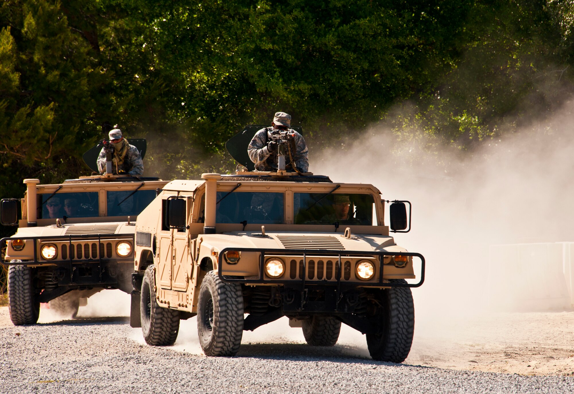 Humvees roll into the Base Tango village as part of a assault demonstration by the 96th Ground Combat Training Squadron.  The demonstration was for Chief Master Sgt. of the Air Force James A. Roy during his tour of the squadron facilities at Eglin Air Force Base, Fla., May 6.  The chief received a hands-on “Brave Defender” experience with the 96th GCTS, firing weapons, watching demonstrations and driving a humvee through a village with simulated improvised explosive devices.  (U.S. Air Force photo/Samuel King Jr.)
