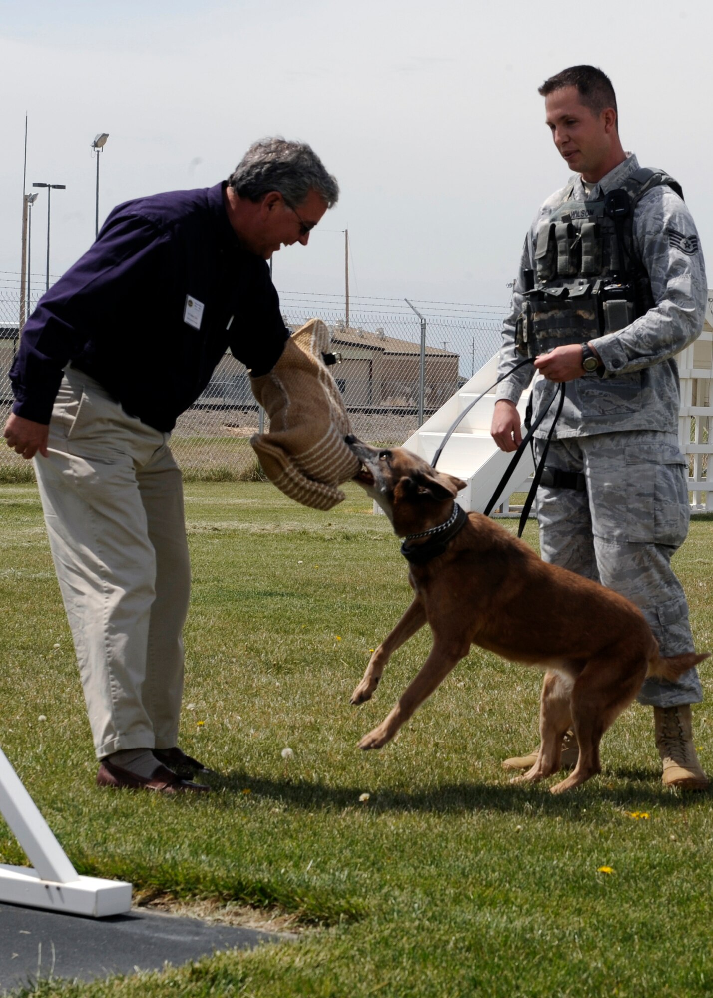 MOUNTAIN HOME AIR FORCE BASE, Idaho – Mr. Danny Eddy volunteers to put on the protective gear to test the power of the 366th Security Forces Squadron’s military working dogs May 6. The members of the Military Affairs Committee were taken on a tour throughout the base to “get their feet wet” in the culture of the Gunfighters. (U.S. Air Force photo by Senior Airman Angelina Drake)
