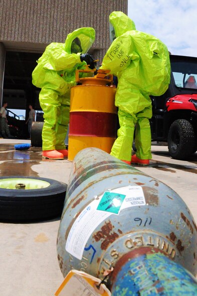 LAUGHLIN AIR FORCE BASE, Texas – Members of Laughlin's fire department participate in a hazardous material training scenario here May 6. The training was focused on capping and sealing leaks that may be found during a real world situation. (U.S. Air Force photo by Senior Airman Scott Saldukas)