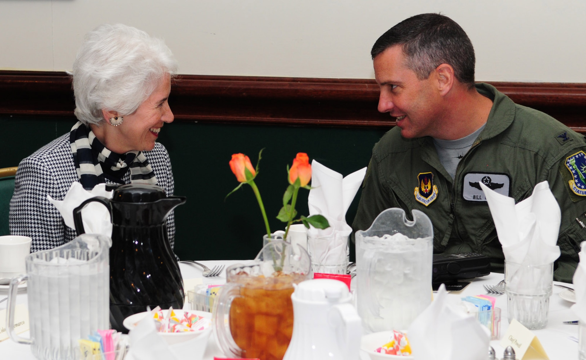 RAF LAKENHEATH, England -- Eva Clarke, a Holocaust survivor, chats with Col. Bill Lewis, 48th Fighter Wing vice commander, at the Holocaust Remembrance Week luncheon May 6, 2011. Mrs. Clarke, whose parents were kept prisoner in concentration camps during the war, solely because they were Jewish, spoke at the luncheon as part of the Holocaust Remembrance Week events. She was born on the back of a coal truck, three days before the U.S. Army liberated the camp. (U.S. Air Force photo/Karen Abeyasekere) 