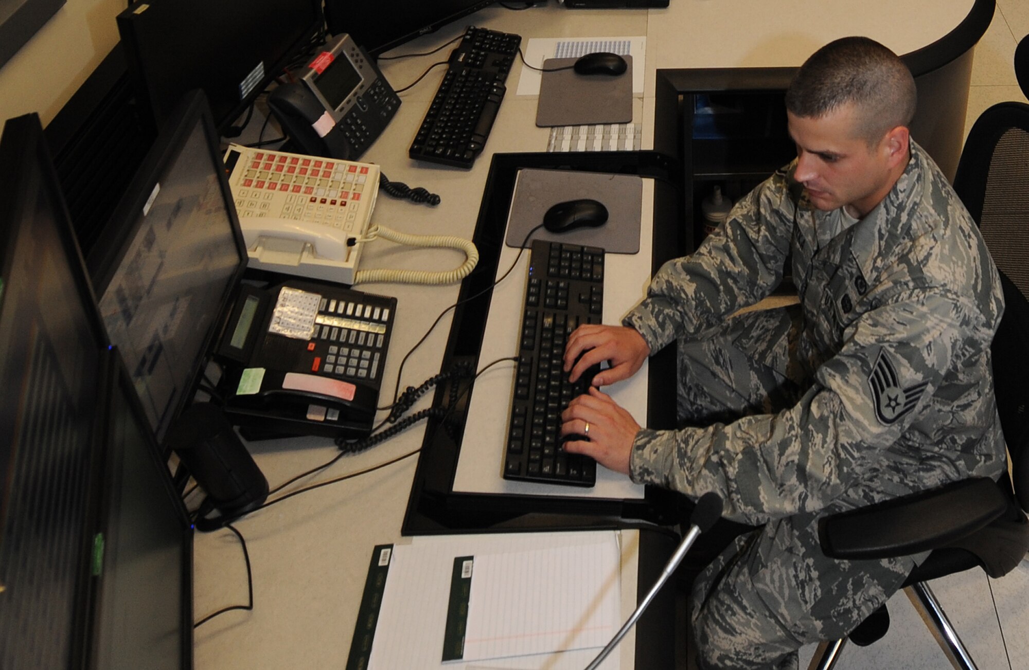 Staff Sgt. Jason Garstka coordinates daily situational report inputs at an undisclosed location in Southwest Asia, May 4. Sergeant Garstka is a senior command post controller with the 379th Air Expeditionary Wing and is deployed from Peterson AFB, Colo. (U.S. Air Force photo/Staff Sgt. Liliana Moreno)                      
