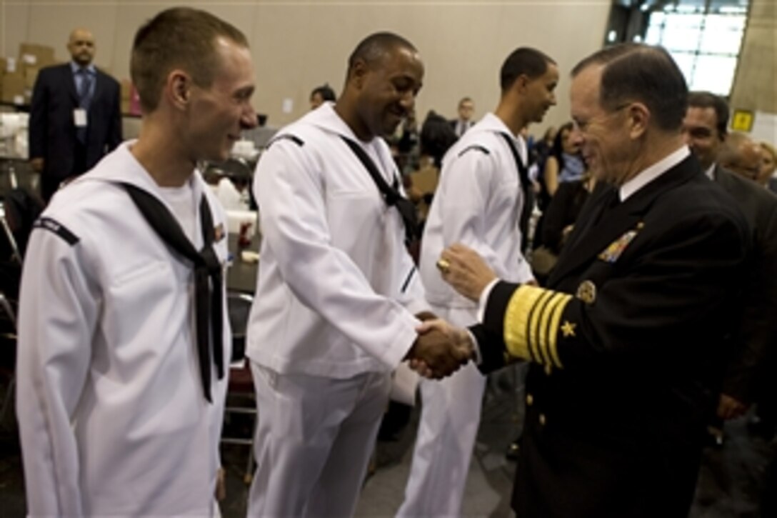 Chairman of the Joint Chiefs of Staff Adm. Mike Mullen, U.S. Navy, greets sailors at the 2011 Robin Hood Foundation Gala in New York City on May 9, 2011.  Robin Hood has targeted poverty in New York City by supporting and developing organizations that provide direct services to poor New Yorkers.  