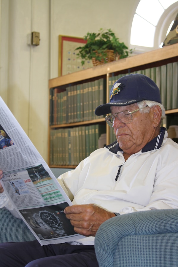 Anton J. Koller, a retired Navy chaplain, reads a newspaper in one of the rooms of the depot library May 10. "I enjoy the privilege of using the library, not only for reading the paper but for the books as well," said Kollor.