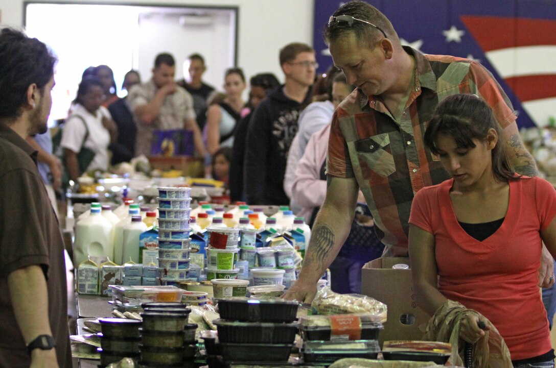 More than 100 Camp Pendleton families receive free groceries at the Abby Reinke Center, May 10. The event, which was provided by the base’s Marine Corps Community Services, gave out items such as bread, milk, eggs, various meats, frozen foods and fruits and vegetables.