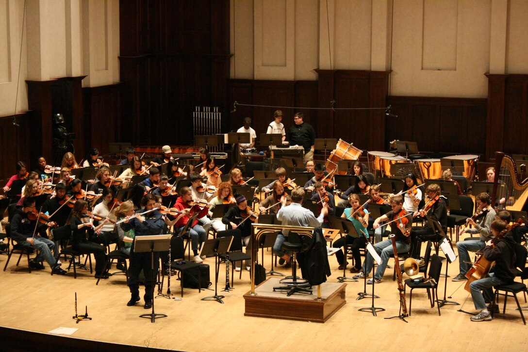 Master Sergeant Sandra Tiemens rehearses a work for solo flute and orchestra with the Detroit Civic Youth Orchestra. The performance that evening was enthusiastically received by the Detroit community, and was an outstanding example of "Excellence in All We Do" in our United States Air Force.