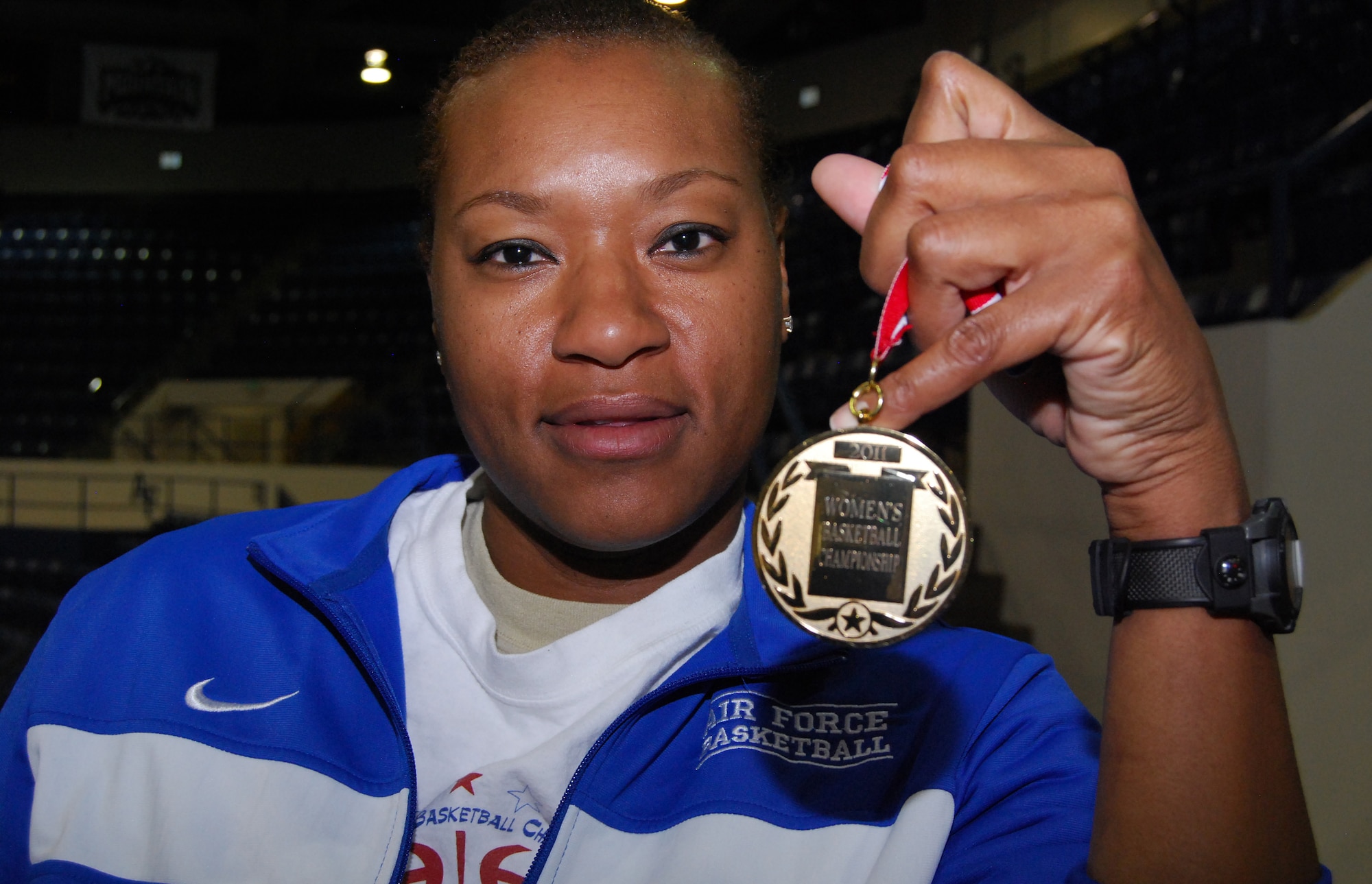 Tech. Sgt. Melissa Fletcher displays her gold medal from the 2011 Armed Forces Basketball Championship, held April 10-17 at Marine Corps Base Camp Pendleton, Calif. Sergeant Fletcher, a mental health NCO with the Air Force Academy's Peak Performance Center, began playing basketball when she joined the Air Force in 1994. Both the Air Force men's and women's teams won gold medals at the championship. (U.S. Air Force photo/Don Branum)