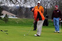 MINOT, N.D. -- Lt. Col. Eric Werner, 5th Bomb Wing staff judge advocate, prepares to make his putt during the Military Affairs Committee Golf Scramble at the Minot Country Club May 9. The Golf Scramble is an annual event designed to enhance community relations between base and civic leadership. (Air Force photo/Senior Airman Michael J. Veloz)