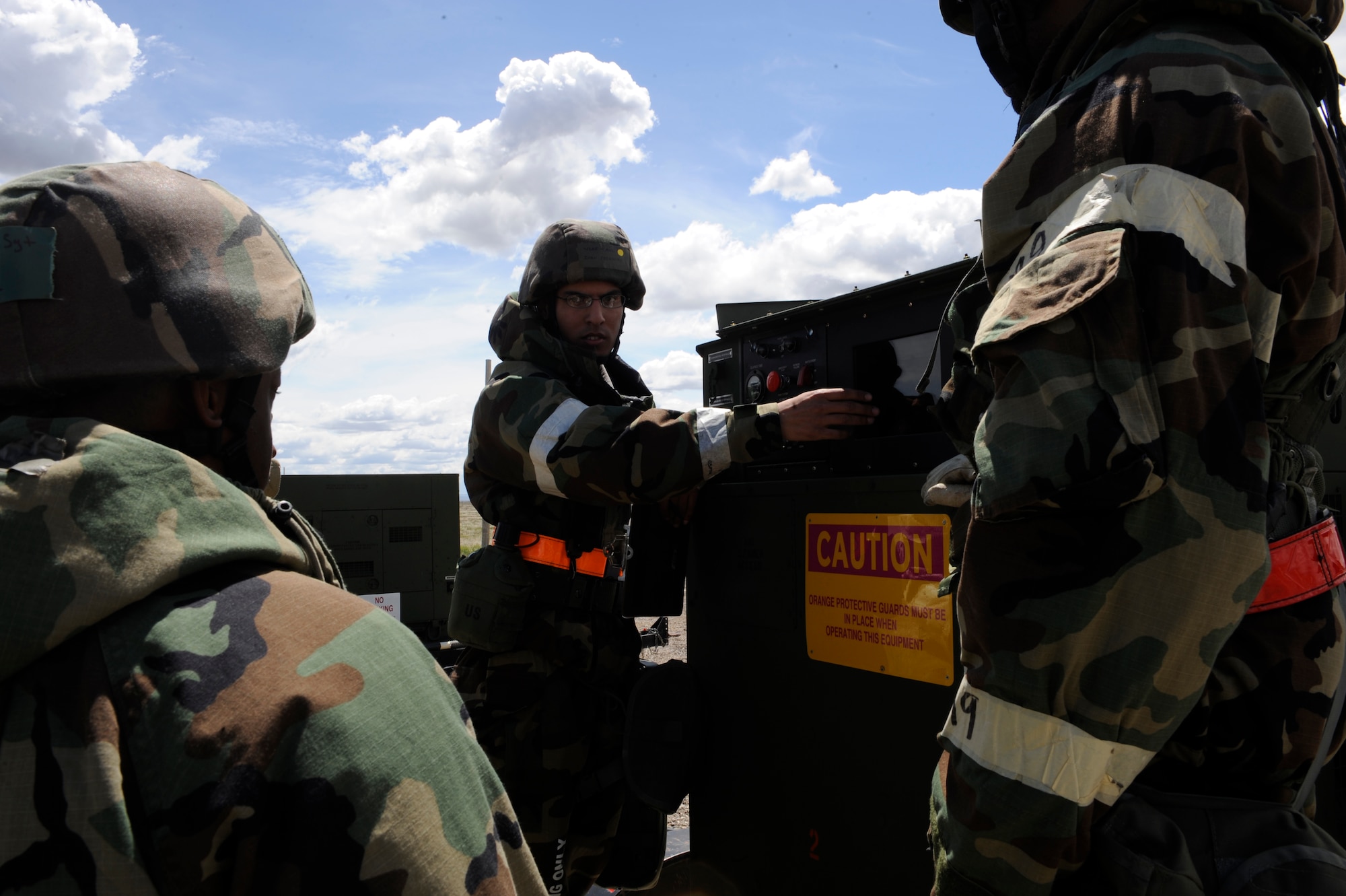 MOUNTAIN HOME AIR FORCE BASE, Idaho – Airman 1st Class Ivan Fredricks, 366th Civil Engineer Squadron, explains the operation of electrical equipment used by their team in order to prevent shorts or surges May 10. Airman Fredricks is one of thousands of Gunfighters participating in the Phase II Operational Readiness exercise. (U.S. Air Force photo by Senior Airman Angelina Drake)