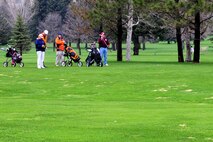 MINOT, N.D. -- Col. Fred Stoss, 91st Missile Wing commander, and members of the Military Affairs Committee prepare for their next drive during the Military Affairs Committee’s Golf Scramble at the Minot Country Club May 9. The Golf Scramble is an annual event designed to enhance community relations between base and civic leadership. (Air Force photo/Senior Airman Michael J. Veloz) 
