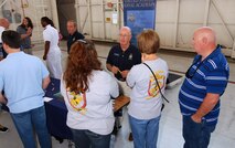 Representatives from the United States Naval Academy talk to students and parents attending Academy Day 2011 at Dobbins ARB, May 7.  (U.S. Air Force photo/ Brad Fallin)