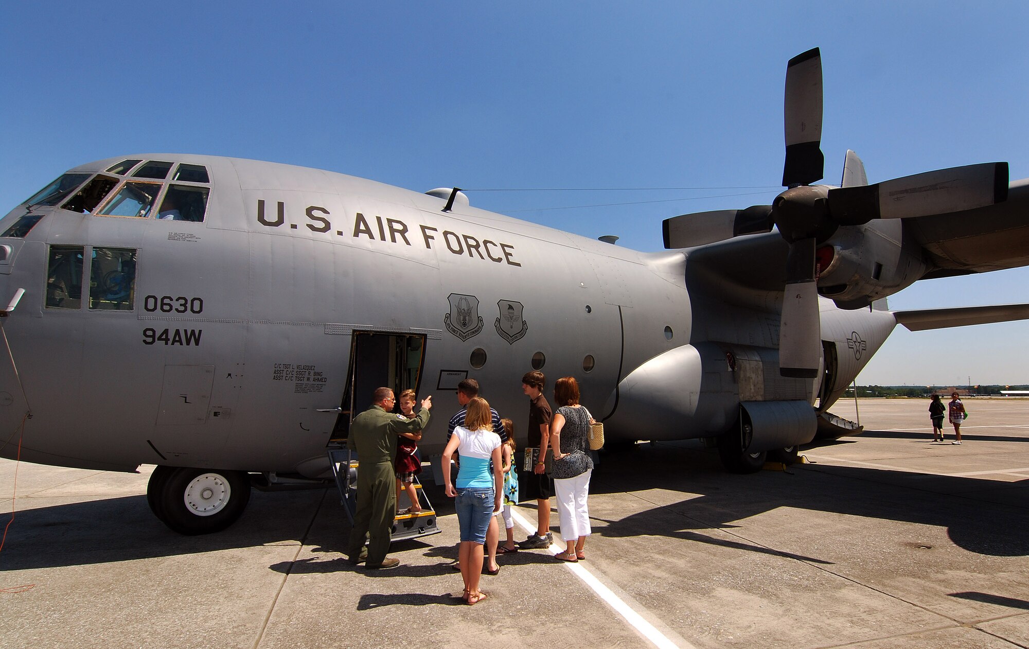 Chief Master Sgt. Mike Lapa, Chief Flight Engineer with the 94th Airlift Wing talks to students and parents attending Academy Day 2011 about the capabilities of the C-130H2 Hercules at Dobbins ARB, May 7.  (U.S. Air Force photo/ Brad Fallin)