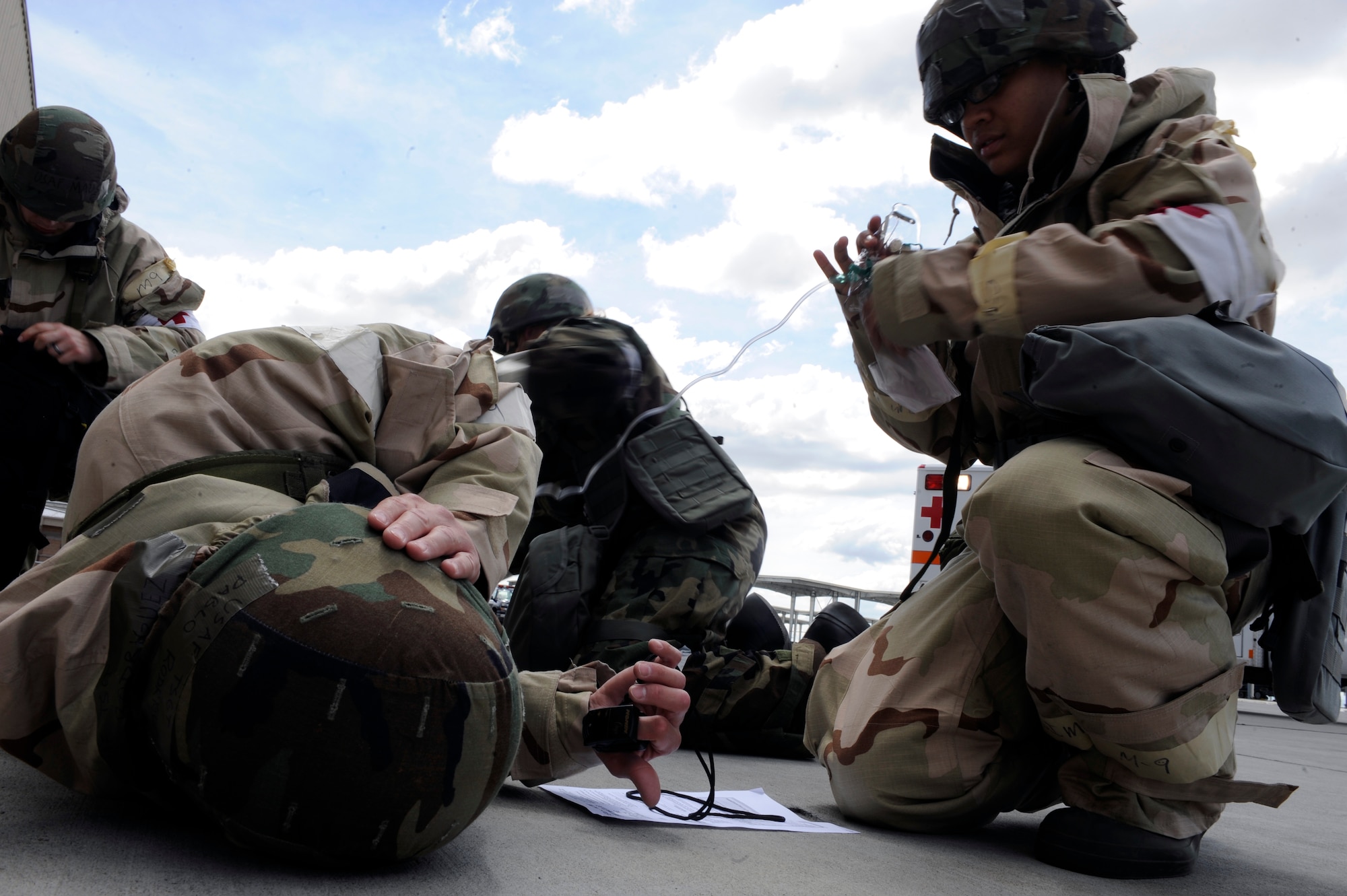 MOUNTAIN HOME AIR FORCE BASE, Idaho – Emergency personnel from the 366th Medical Group rush to assist Staff Sergeant Pablo Rodriguez during the Phase II Operational Readiness Exercise May 10. SSgt Rodriguez was instructed to simulate a heart attack in order to test the Self Aid Buddy Care capabilities of his peers and the emergency care during and exercise. (U.S. Air Force photo by Senior Airman Angelina Drake)