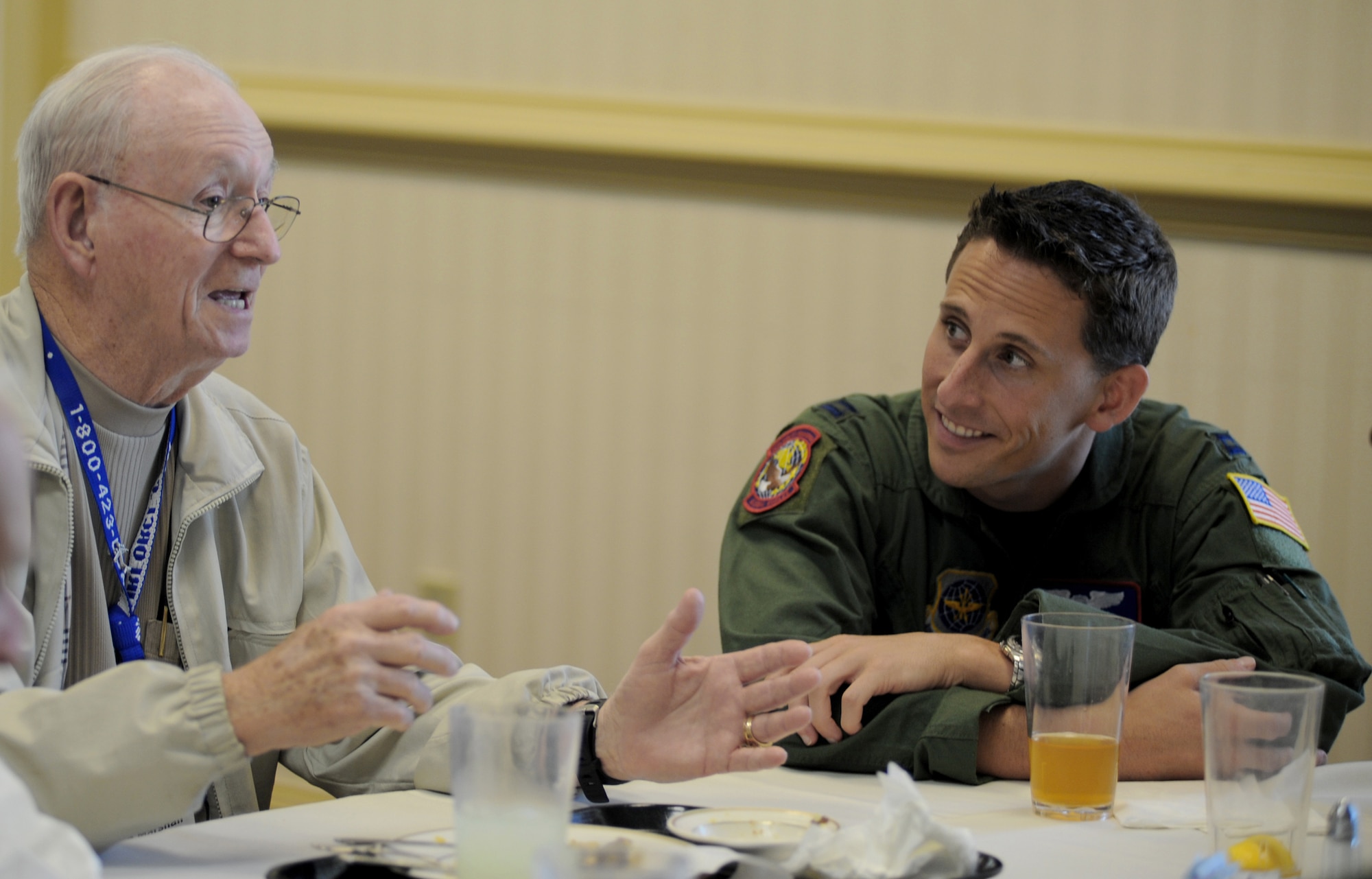 Don Marshall shares one of his World War II stories with Capt. John McDaniel during lunch May 5, 2011, at Joint Base Charleston, S.C. Mr. Marshall was attending the World War II "Hump" pilots reunion. The Hump pilots have met annually since 1946. (U.S. Air Force photo/ Staff Sgt. Nicole Mickle)
