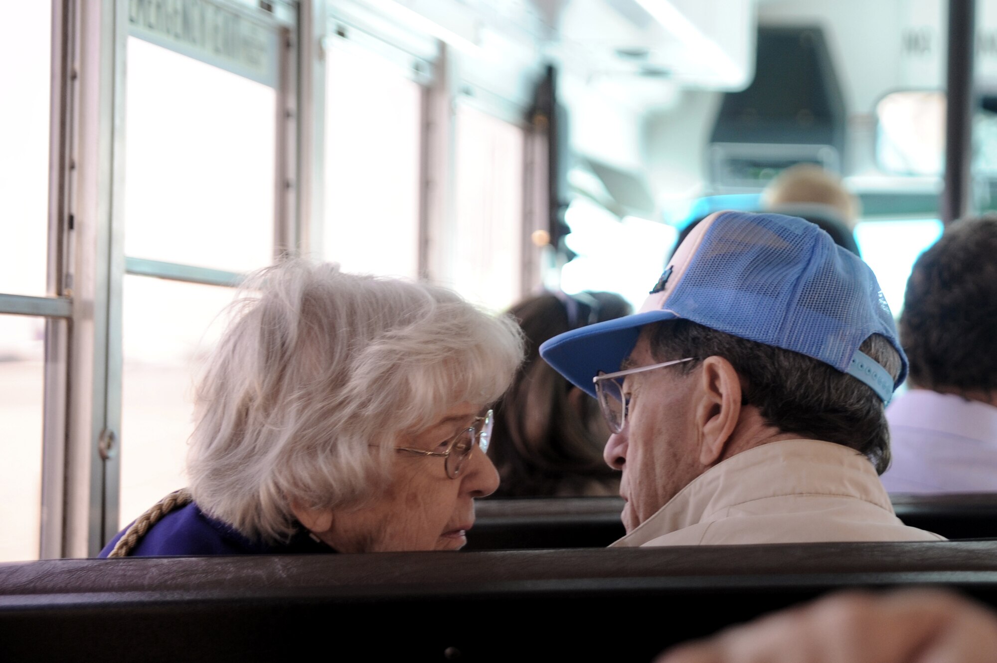 Married for more than 60 years, Bill McKarns and his wife speak during the bus ride to the static C-17 Globemaster III May 5, 2011, at Joint Base Charleston, S.C.. Mr. McKarns was a World War II "Hump" pilot assigned to the U.S. Army Air Corp's Air Transport Command and flew from India into China, transporting trucks, weapons and supplies in support of Chinese soldiers. (U.S. Air Force photo/ Staff Sgt. Nicole Mickle)