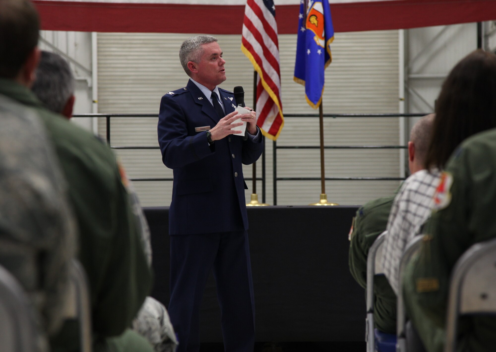 Col. John Trnka, vice wing commander of 940th Wing, speaks to Reservists during a commander's call during the February Unit Training Assembly weekend. Colonel Trinka was the interm and acting wing commander for the 940th Wing for more than eight months. (U.S. Air Force photo/ Tech. Sgt. Kenneth McCann)