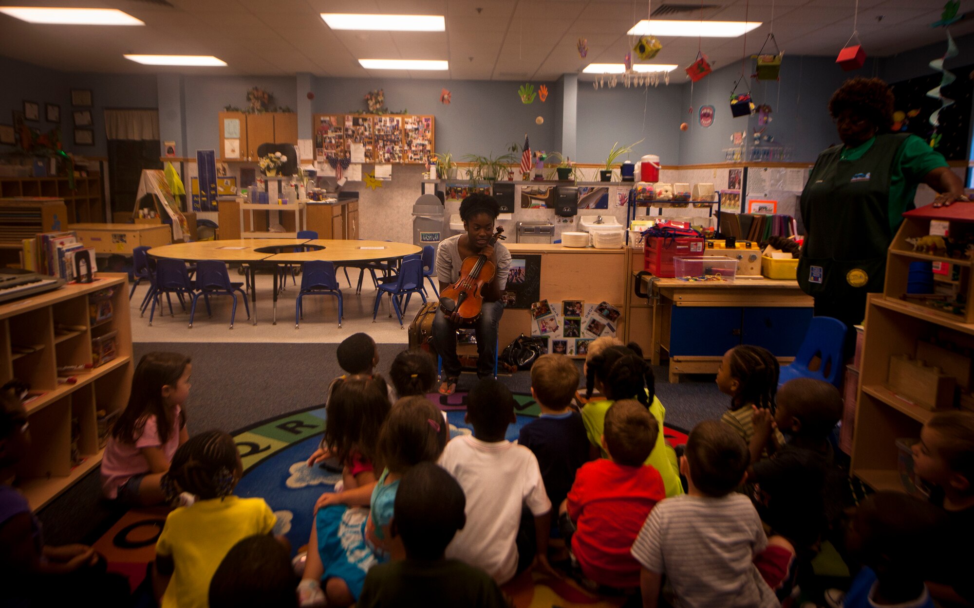 Jovan DeShong, Valdosta State University music education major, speaks to children at the Child Development Center May 9 at Moody Air Force Base, Ga. Ms. DeShong visited Moody to share her talents and influence children through music. (U.S. Air Force photo/ Airman 1st Class Joshua Green)(RELEASED)
