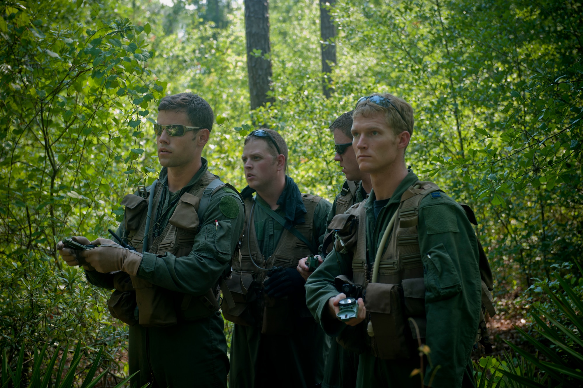Members of the 347th Rescue Group work together to navigate toward their destination at Moody Air Force Base, Ga., May 10. The scenario was part of a survival, evasion, resistance and escape exercise to help familiarize and refresh the members on land navigation. (U.S. Air Force photo/Airman 1st Class Douglas Ellis)(RELEASED)

