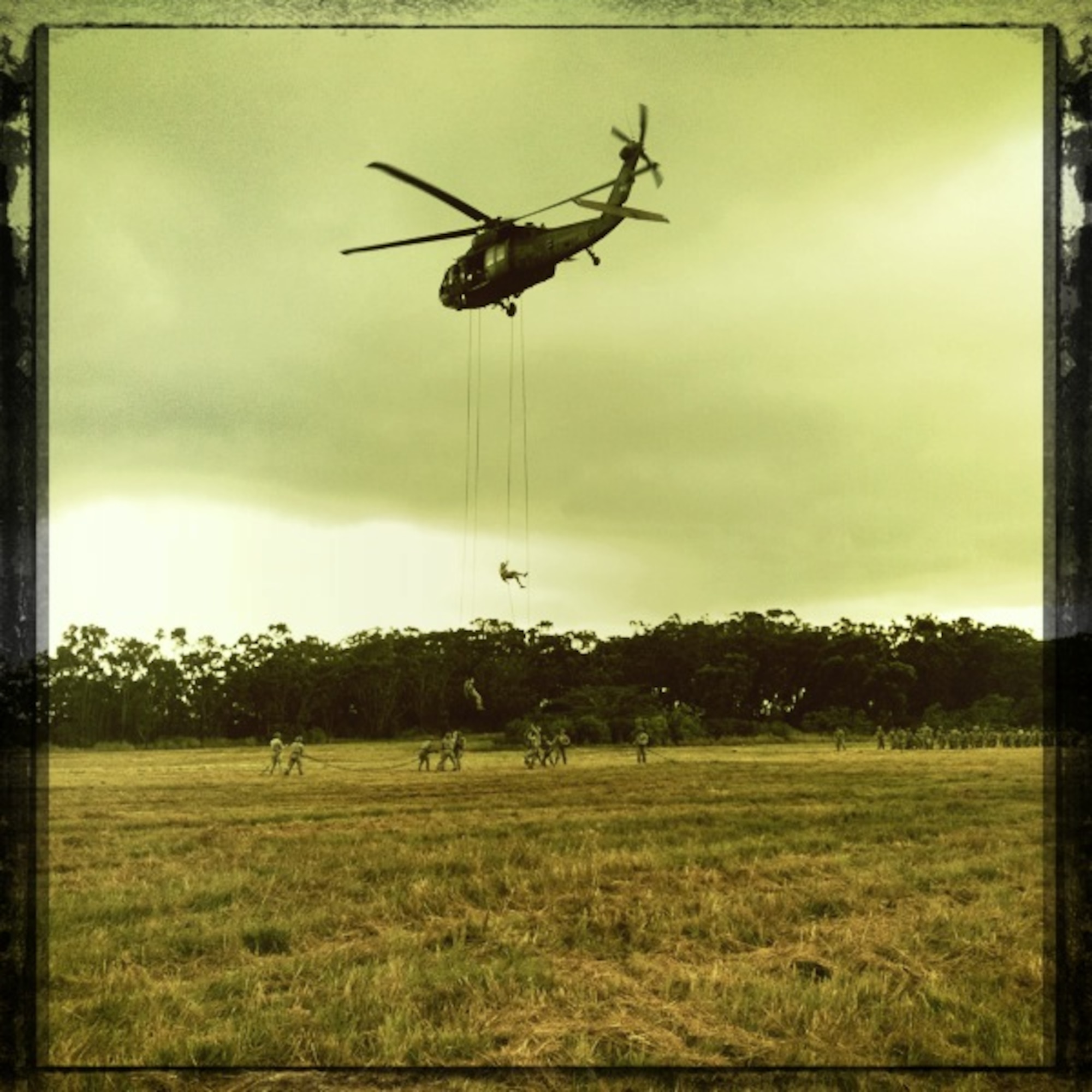 Airmen and Soldiers rappel out of a UH-60 Blackhawk in Wahiawa, Hawaii, May 10. Five Pacific Air Forces 647th Security Forces Squadron Airmen were chosen to participate with 309 Soldiers in an 11-day Army Air Assault course April 30 to May 11, 2011. (U.S. Air Force photo/Staff Sgt. Carolyn Herrick)