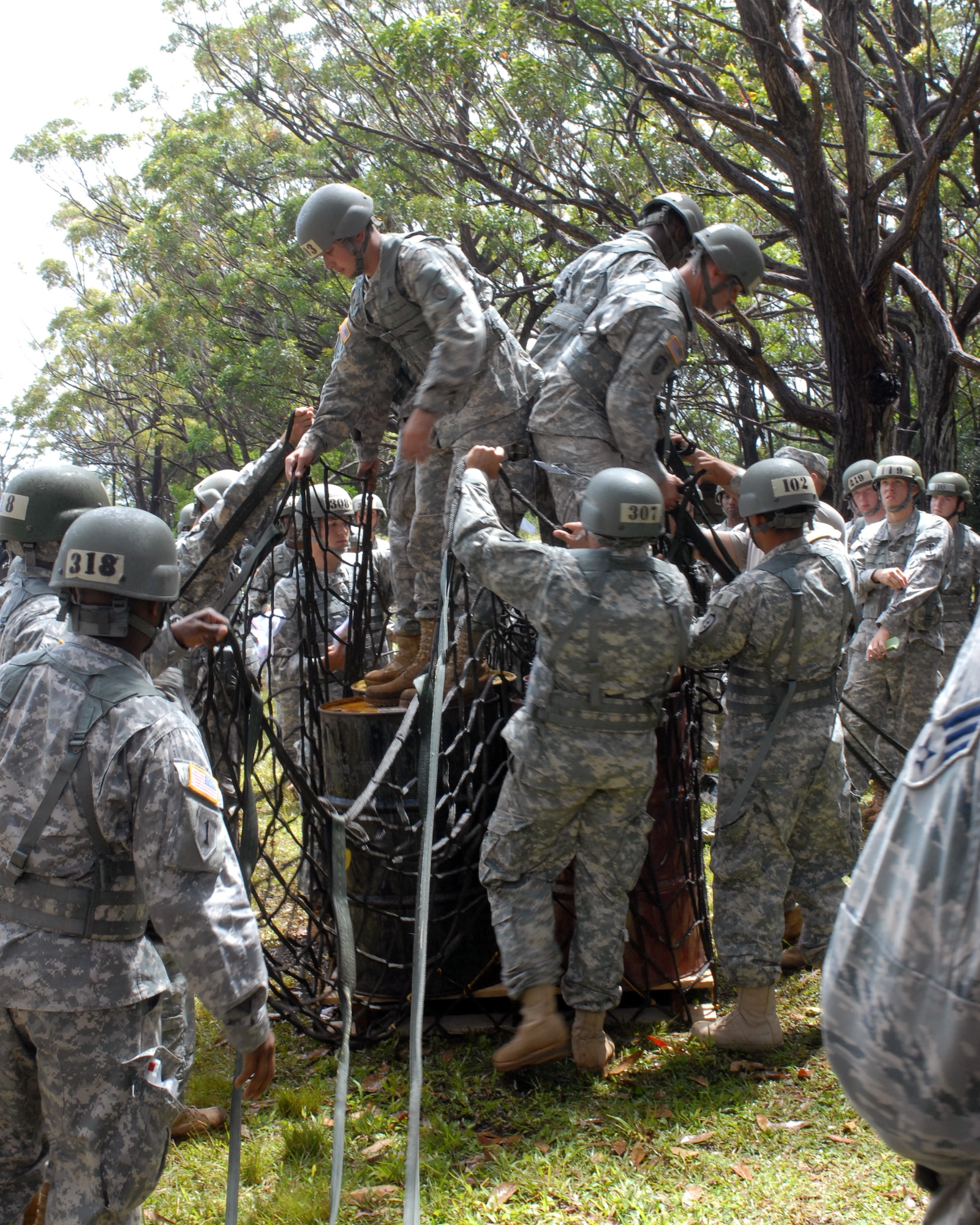 Airmen and Soldiers learn how to properly sling load cargo during the Air Assault course in Wahiawa, Hawaii, May 4. Five Pacific Air Forces 647th Security Forces Squadron Airmen were chosen to participate with 309 Soldiers in this intense, 11-day course April 30 to May 11, 2011. (U.S. Air Force photo/Staff Sgt. Carolyn Herrick)