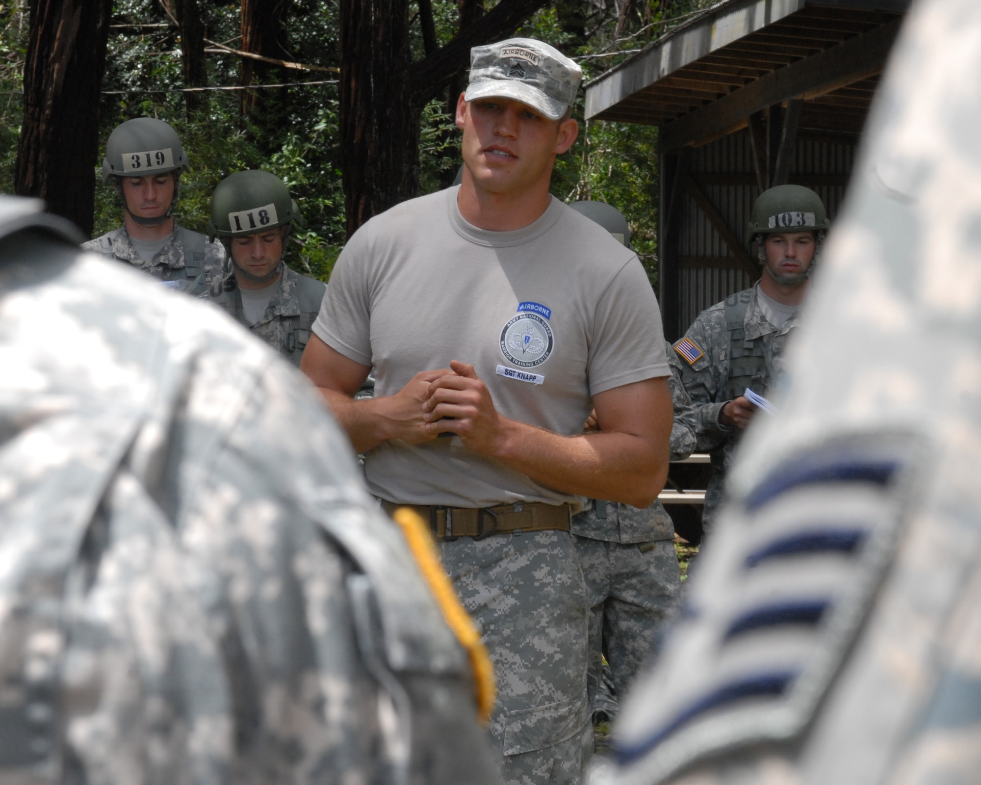 An instructor from the Warrior Training Center at Ft. Benning, Ga., teaches Airmen and Soldiers how to properly perform a sling load during the Air Assault course in Wahiawa, Hawaii, May 4. Five Pacific Air Forces 647th Security Forces Squadron Airmen were chosen to participate with 309 Soldiers in this intense, 11-day course April 30 to May 11, 2011. (U.S. Air Force photo/Staff Sgt. Carolyn Herrick)