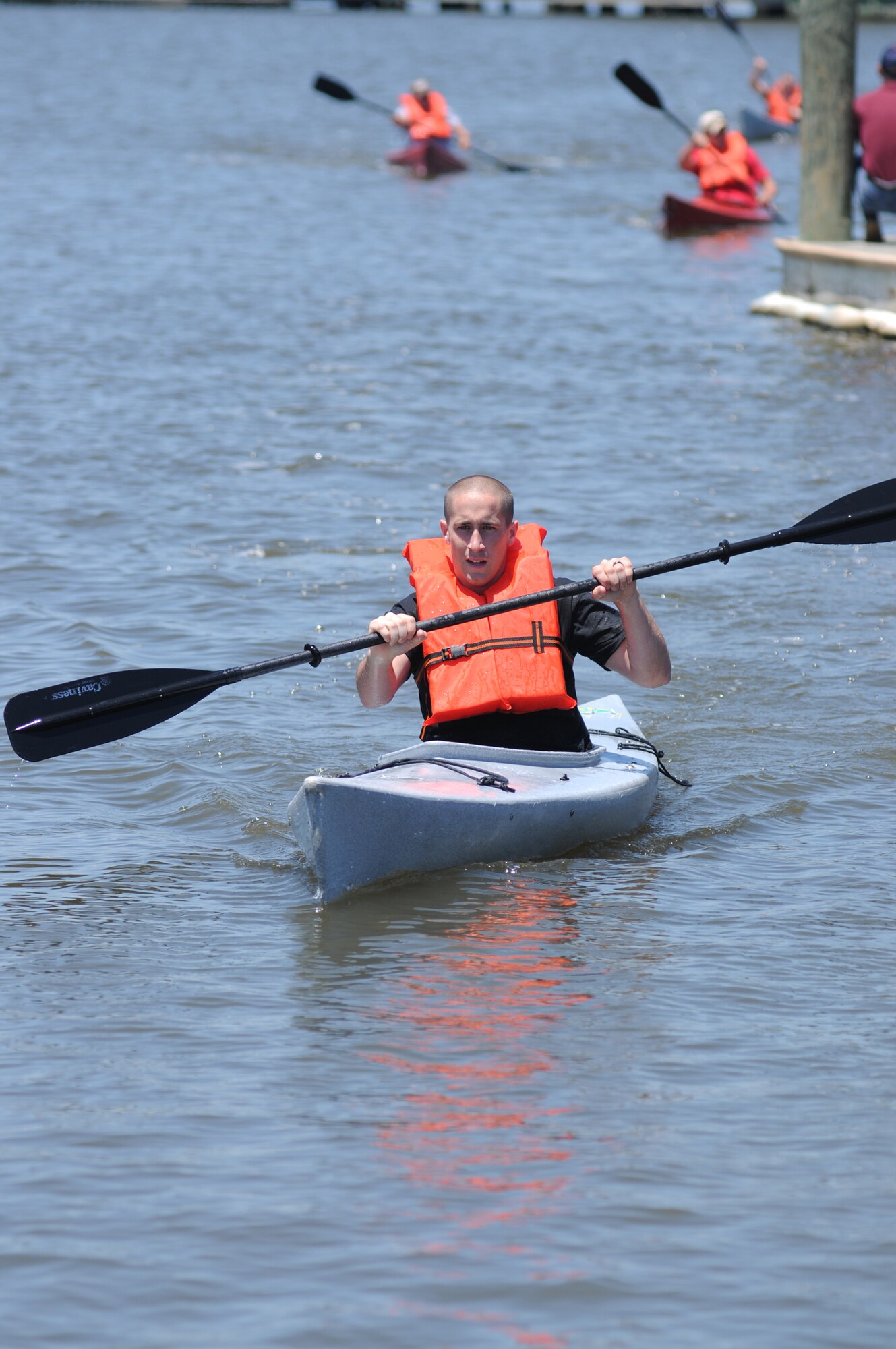 Chad Harris, 345th Airlift Squadron, navigates the waters of Biloxi’s Back Bay in the kayak race.   (U.S. Air Force photo by Kemberly Groue)