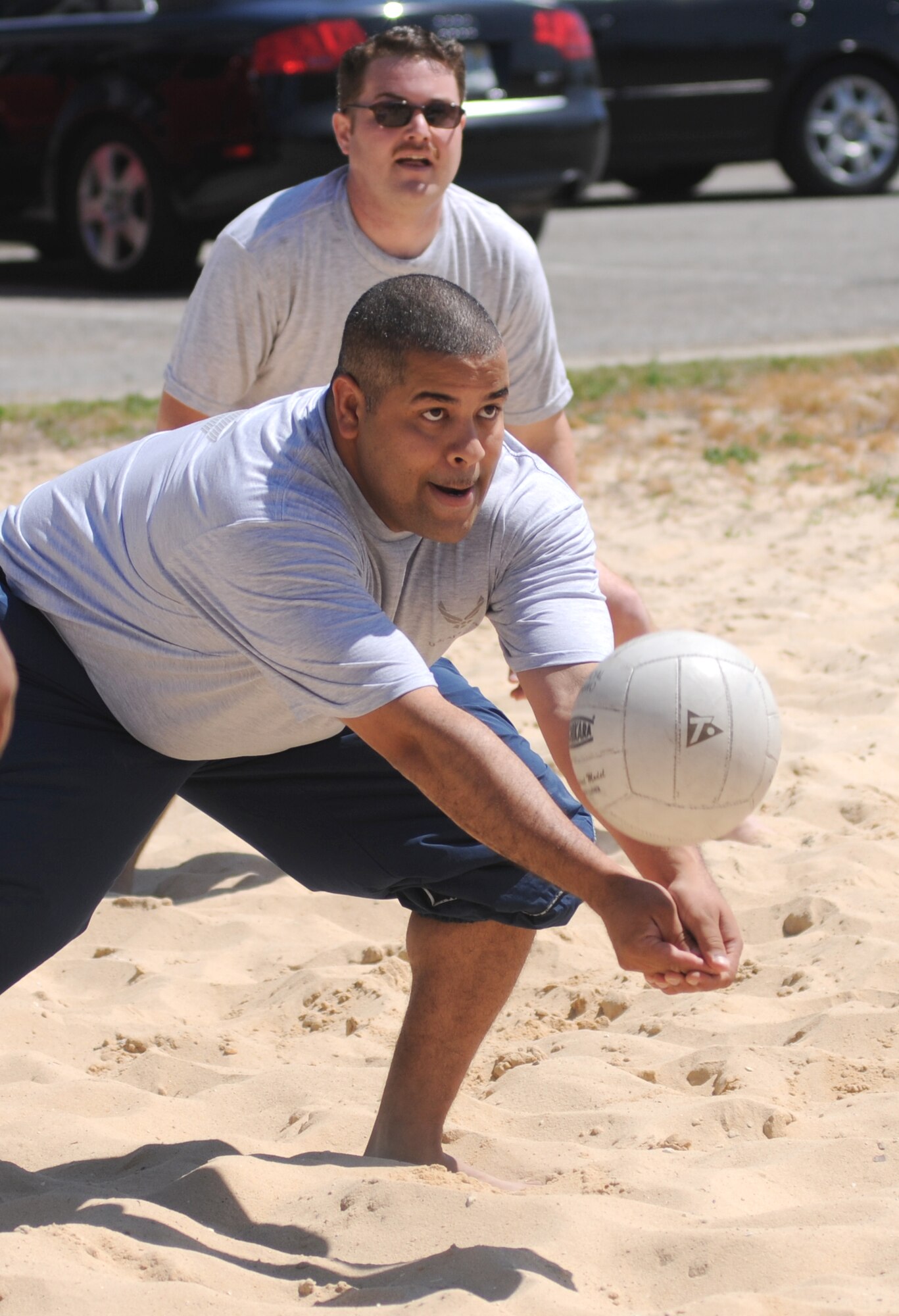 Ramon Santiago, 81st FSS, bumps the volleyball back into play during a sand volleyball match at Sports Day, May 5. His team won first place large squadron honors for the day.   (U.S. Air Force photo by Kemberly Groue)