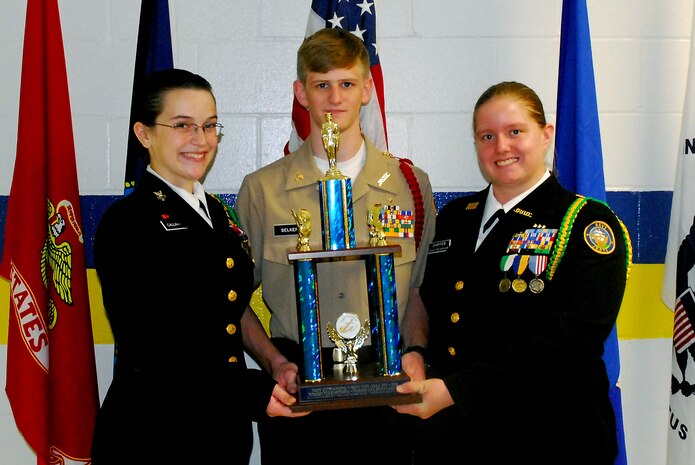 (Left to right) Summerville High School Navy Junior Reserve Officers Training Corps Cadet Petty Officer 1st Class Molly Callahan, Cadet Chief Petty Officer Daniel Belken and Cadet Executive Officer Danielle Shaffer, accept the trophy for being the most outstanding NJROTC unit for Area Six, April 29. The award was presented by the U.S. Navy League and is given to the unit that has excelled in citizenship, academics and team competitions during the course of the year. The Summerville High School NJROTC is also ranked as one of the top 11 NJROTC units nationwide. (U.S. Navy photo/Machinist’s Mate 3rd Class Brannon Deugan)