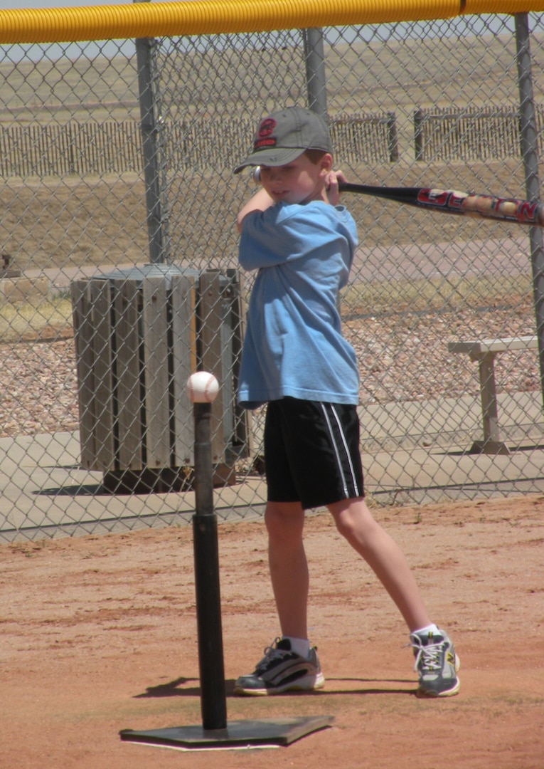 SCHRIEVER AIR FORCE BASE, Colo. -- Harris Giles, son of Lt. Col. John Giles, 50th Network Operations Group, takes a swing during the Aquafina Major League Baseball Pitch, Hit and Run competion May 7 at the Schriever base softball field. "Awesome event for Schriever affiliated kids," Colonel Fischer said. "Thanks for putting on a great event. It was very professional and organized for the kids and parents." (Courtesy photo)  