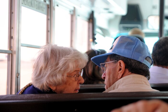 Married for more than 60 years, Bill McKarns and his wife share a moment during the bus ride to the static C-17 on Joint Base Charleston, May 5. Mr. McKarns was a World War II Hump pilot assigned to the U.S. Army Air Force's Air Transport Command and flew from India into China, transporting trucks, weapons and supplies in support of Chinese soldiers. (U.S. Air Force photo/ Staff Sgt. Nicole Mickle)  (Released)