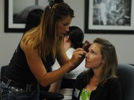 Shelly Rucker has her make-up done by a volunteer professional make-up artist at the Military Spouses' Appreciation Tea on Joint Base Charleston, May 7. The Tea was sponsored by the Airmen and Family Readiness Center to show appreciation for military spouses. The event included giveaways, make-overs, crafts and a special appearance by Terry Serpico, who plays Col. Frank Sherwood on the television series Army Wives.  (U.S. Air Force photo/ Staff Sgt. Nicole Mickle)