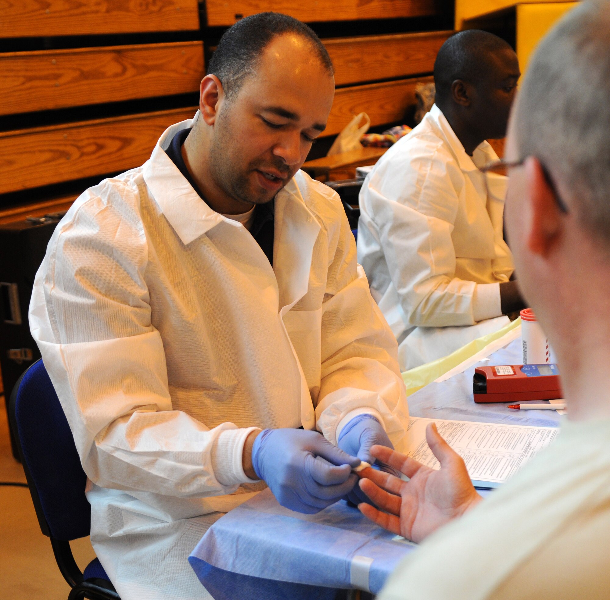 RAF MILDENHALL, England -- Sam Castrol, a lab technician from Landstuhl Regional Medical Center, Germany, collects a blood sample from Master Sgt. David Vanwinkle, 100th Logistics Readiness Squadron and blood donor, during the Armed Services Blood Program blood drive at RAF Mildenhall May 11, 2011. The blood sample is used to check the iron level in the donator?s blood to ensure that the person has enough iron in their blood to replenish the blood that was donated. (U.S. Air Force photo/Airman 1st Class Rachel Waller)