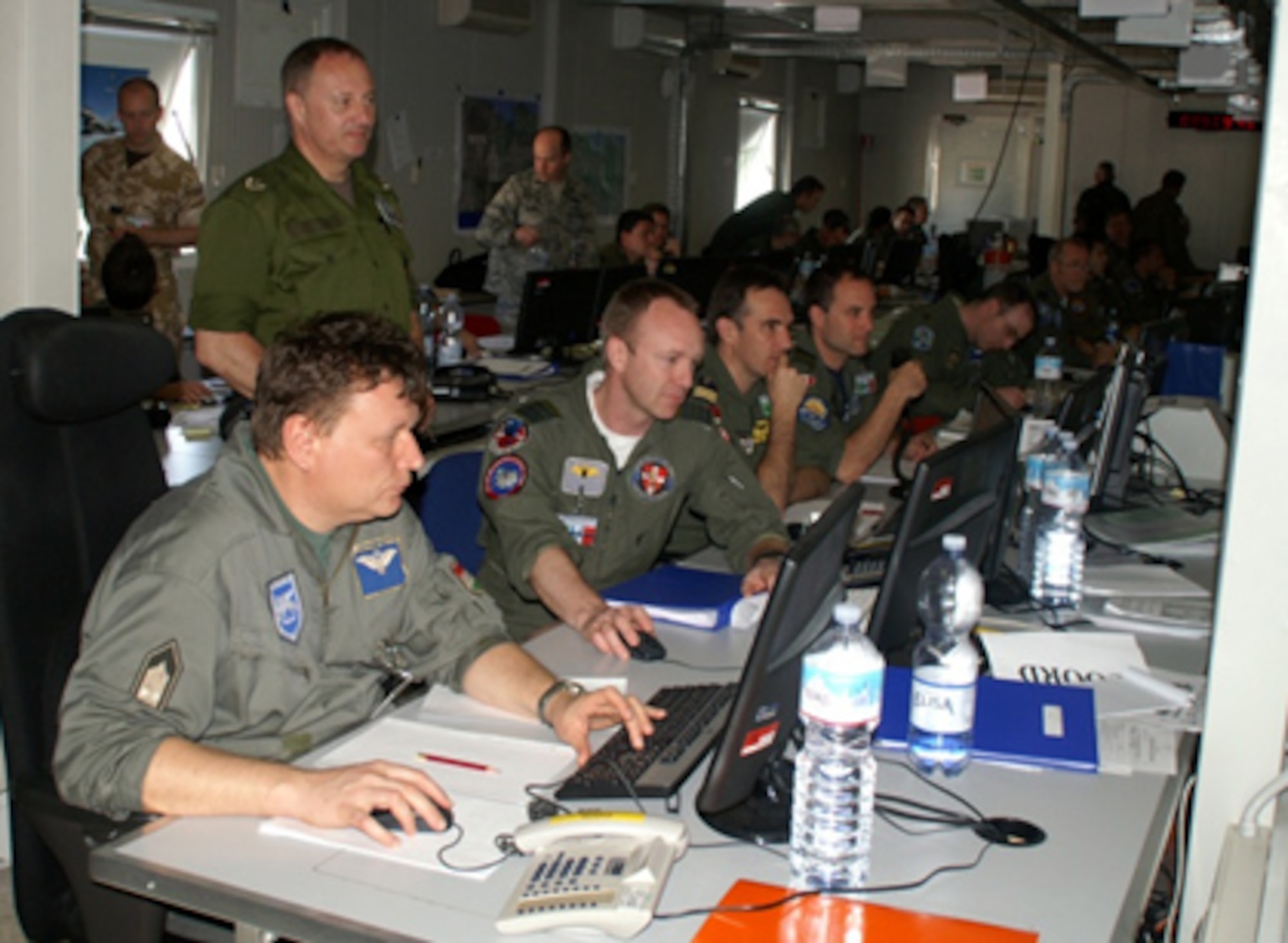 International partners from 28 countries work 24 hours a day in Operation Unified Protector at the NATO Combined Air Operations Center 5 in Western Europe.  The emphasis is on protecting the Libyan civilian population from regime ground forces, requiring a maximum number of aircraft sorties and making air refueling the “linchpin” of the operation. (NATO photo by Lt. Col. Thomas Dillschneider) 
