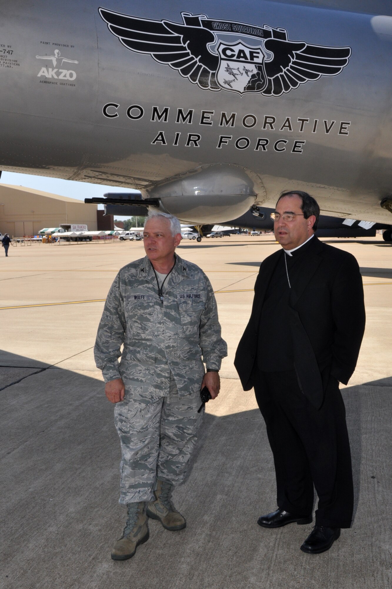 Col. Kevin Wolfe, commander, 307th Mission Support Group, and Bishop Michael Duca of the Shreveport Diocese take advantage of the shade provided by “FIFI” a B-29 sitting on the ramp at Barksdale Air Force Base, La., May 6, 2011. While on base, Bishop Duca, along with Bishop Neal J. Buckon, of the Archdiocese for the Military Services, USA, visited with military clergy from Air Force Global Strike Command and the 2nd Bomb Wing. The reason for their visit to Barksdale was to celebrate Confirmation with the Holy Family Catholic Parish on base. During their time on the ramp, Bishops Buckon and Duca were able to witness several acts that were practicing for the Defenders of Liberty 2011 Air Show. (U.S. Air Force photo/Tech. Sgt. Jeff Walston)  