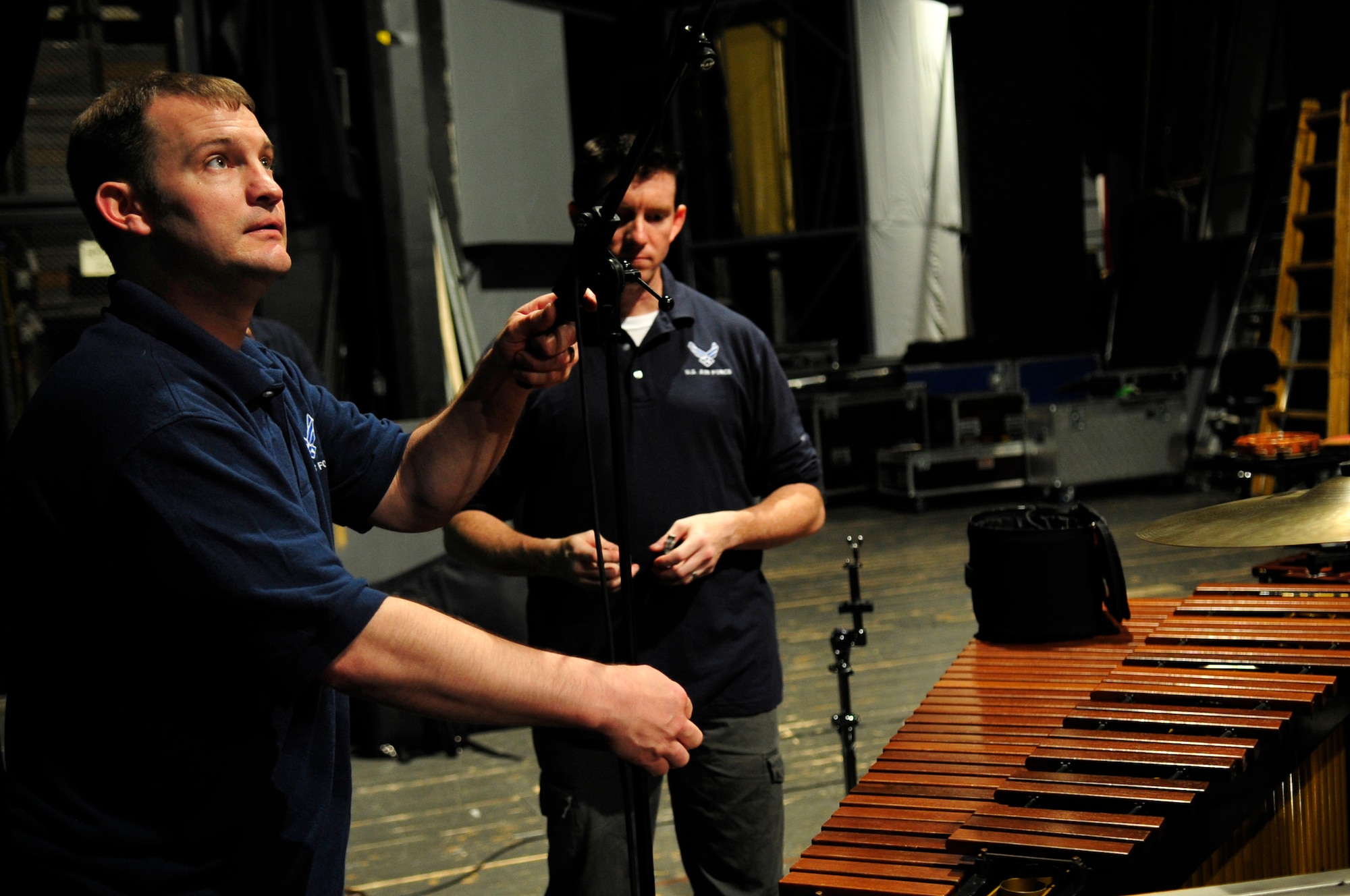 U.S. Air Force Staff Sgt. Clayton Allen, audio technician and supply manager with the United States Air Forces in Europe Band sets up the stage before a performance, Bratislava, Slovakia, May 4, 2011. The USAFE concert band is on tour through three countries, performing at seven locations as part of a building partnerships capacity and community outreach initiative. (U.S. Air Force Photo by Tech Sgt. Jocelyn L. Rich)