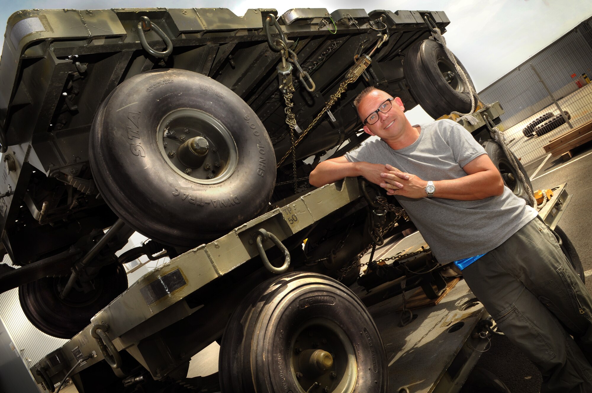 Kasper Chevalier, an aerial porter with the 721st Aerial Port Squadron, recently hit a milestone in his career as he completed 721 aerial port expeditor loads.  Mr. Chevalier has completed the most APEX loads for either military or civilian members worldwide.  (U.S. Air Force photo by Staff Sgt. Tyrona Lawson)
