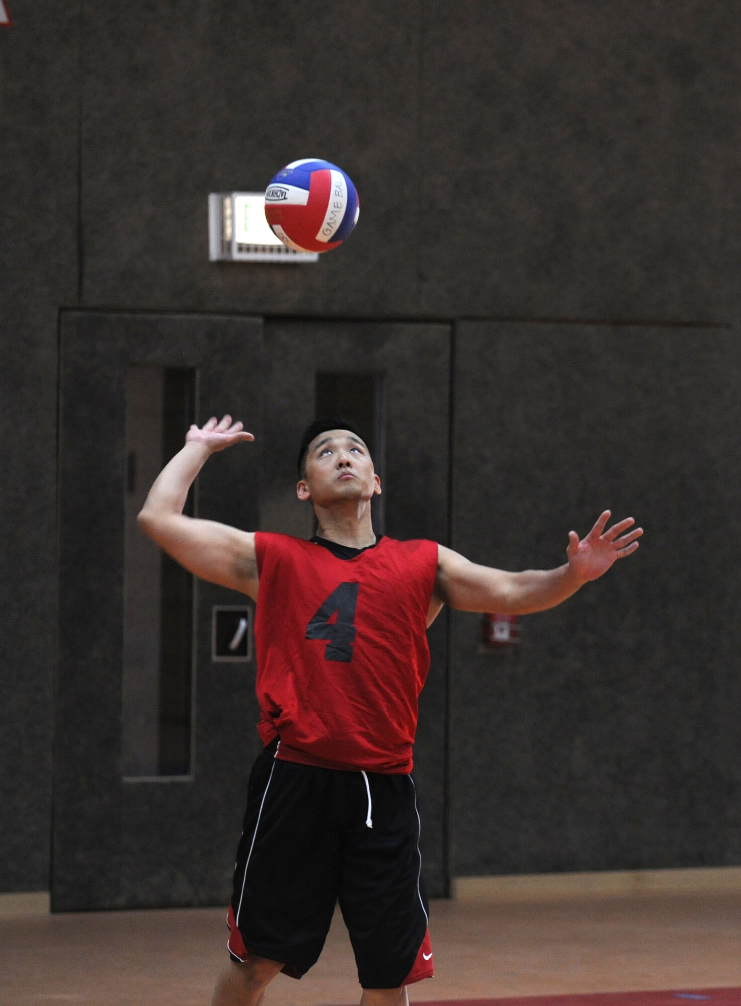 SPANGDAHLEM AIR BASE, Germany – Scott Whipple, 52nd Medical Group, prepares to serve the ball during the intramural volleyball championship series here May 9 against the 52nd Civil Engineer Squadron. The CES defeated MDG 25-16, 19-25, 15-10 to become the intramural volleyball champions. (U.S. Air Force photo/Senior Airman Nathanael Callon)