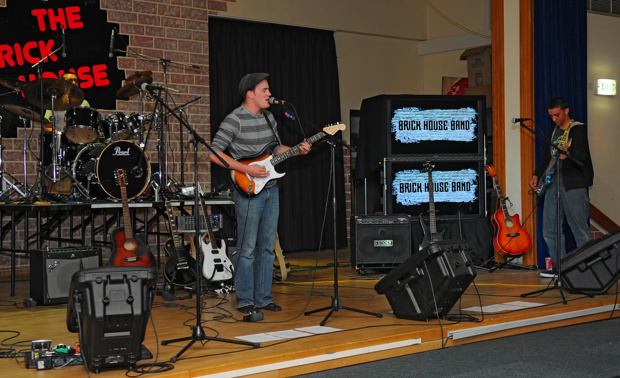 SPANGDAHLEM AIR BASE, Germany – Airman 1st Class James Herer, 606th Air Control Squadron; Airman Steven Marrinier, Spangdahlem American Forces Network; and Airman 1st Class Michael Passanando, 81st Fighter Squadron, perform as the band “Scarlett Fox” during the Open Jam Night at the Brick House here May 3. The Brick House’s Open Jam Night allows base members to showcase their musical talents in front of an audience once a month. (U.S. Air Force photo/Airman 1st Class Dillon Davis)