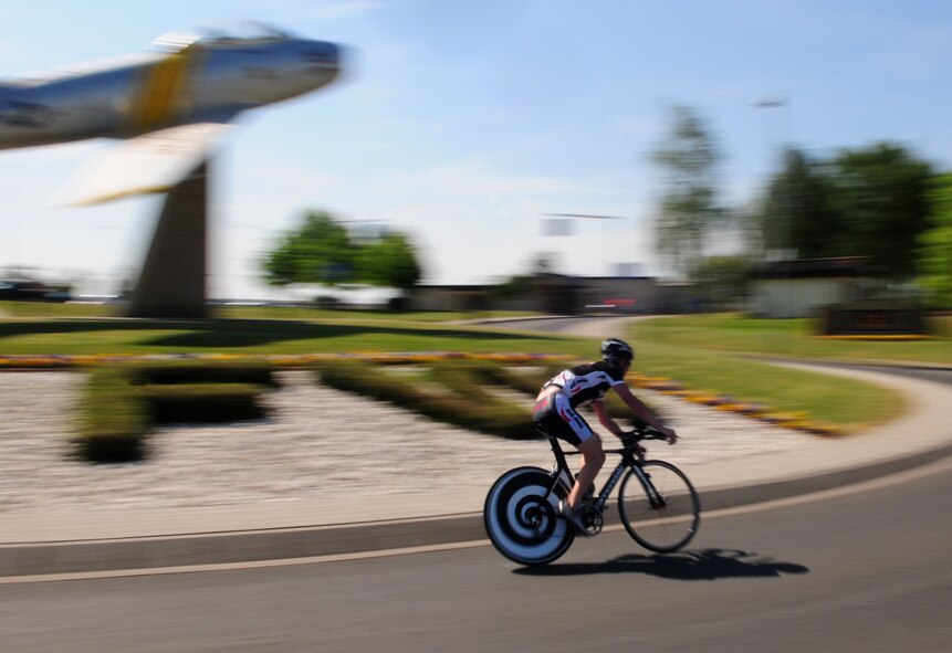 SPANGDAHLEM AIR BASE, Germany – Kevin Toups, Air Force Office of Special Investigations, bikes around a traffic circle during the duathlon sponsored by the Skelton Memorial Fitness Center here May 7. The fitness center sponsored the event as part of National Physical Fitness and Sports Month.  Mr. Toups, Air Force Office of Special Investigations, won the street bike division with a time of 1:32:11, and Glenn Mitchell, 52nd Civil Engineer Squadron, won the mountain bike division with a time of 1:41:31. (U.S. Air Force photo/Airman 1st Class Matthew B. Fredericks)