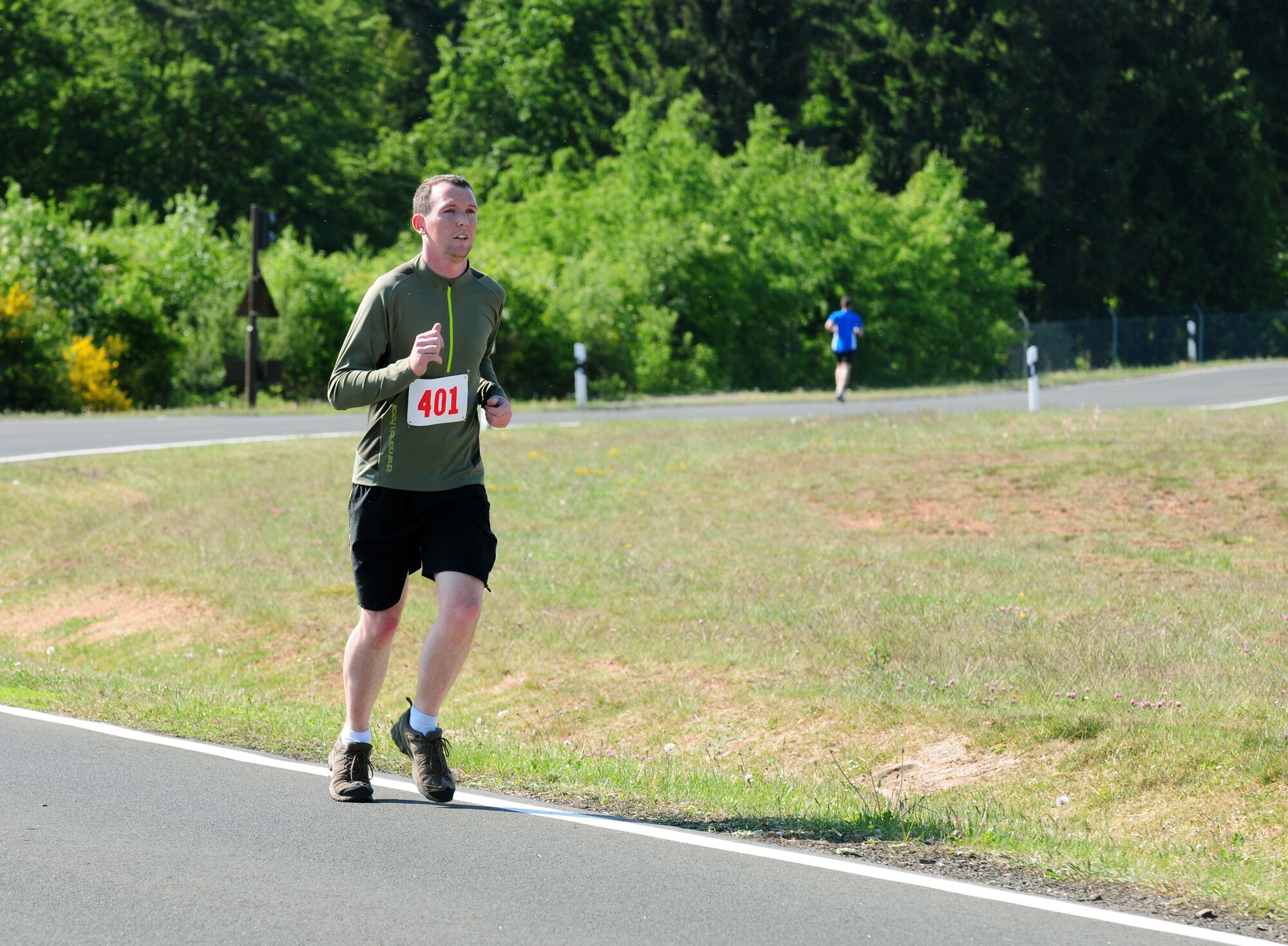 SPANGDAHLEM AIR BASE, Germany – Glenn Mitchell, 52nd Civil Engineering Squadron, competes during the run portion of a duathlon sponsored by the Skelton Memorial Fitness Center here May 7. The fitness center sponsored the event as part of National Physical Fitness and Sports Month. Kevin Toups, Air Force Office of Special Investigations, won the street bike division with a time of 1:32:11, and Mr. Mitchell, 52nd Civil Engineer Squadron, won the mountain bike division with a time of 1:41:31. (U.S. Air Force photo/Airman 1st Class Matthew B. Fredericks)