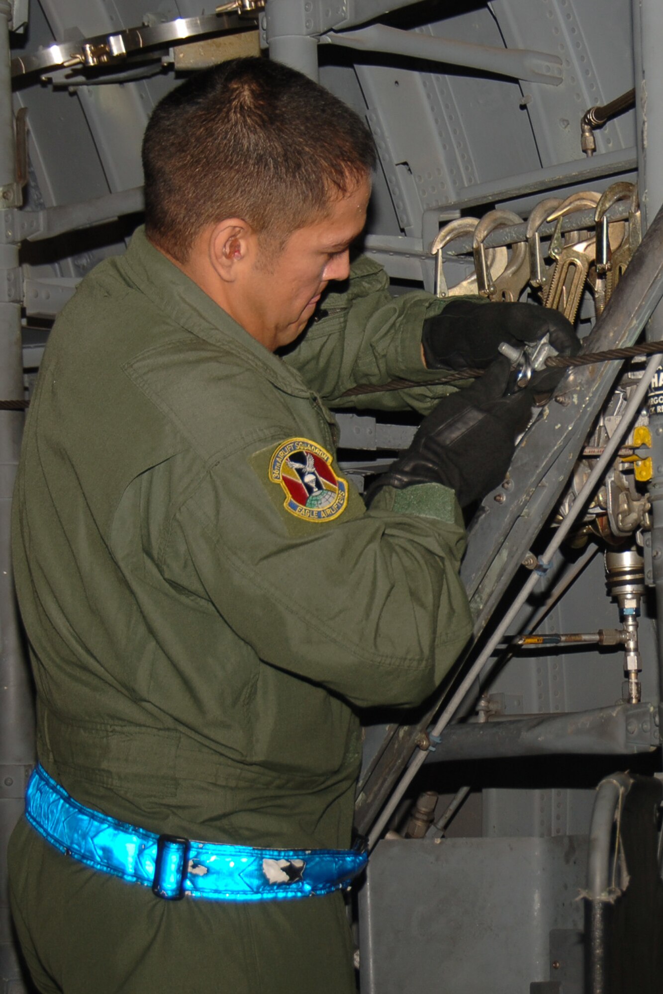 YOKOTA AIR BASE,Japan -- Tech. Sgt. Pablo Herrera, 36th Airlift Squadron loadmaster, inspects the equipment on a C-130 airplane before take-off during a practice run for the 2011 Air Mobility Command Rodeo here, May 11, 2011. The competition will take place July 23-29 at Joint-Base Lewis-McChord, Wash., and will allow Airmen within AMC to display their wing's ability to perform critical wartime skills including aircrew operations, combat mobility, maintenance and security forces. (U.S. Air Force photo/Airman 1st Class Lynsie Nichols)