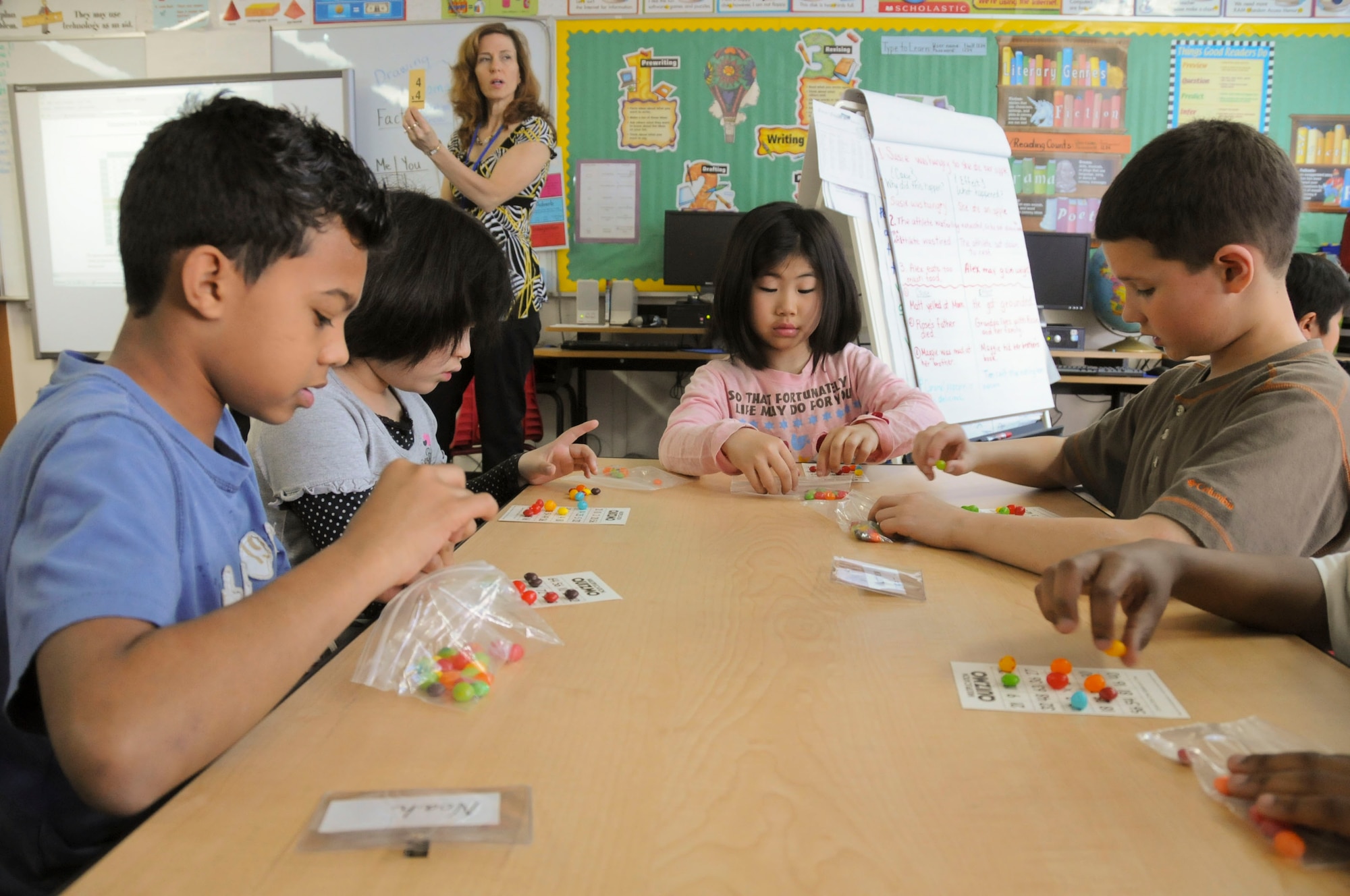 MISAWA AIR BASE, Japan -- American and Japanese students play a math bingo game together here, May 10. More than 30 third-grade students from Omagari Elementary School in Rokunohe Town visited Cummings Elementary School where they met and interacted with more than 40 American students. (U.S. Air Force photo/Staff Sgt. Rachel Martinez)