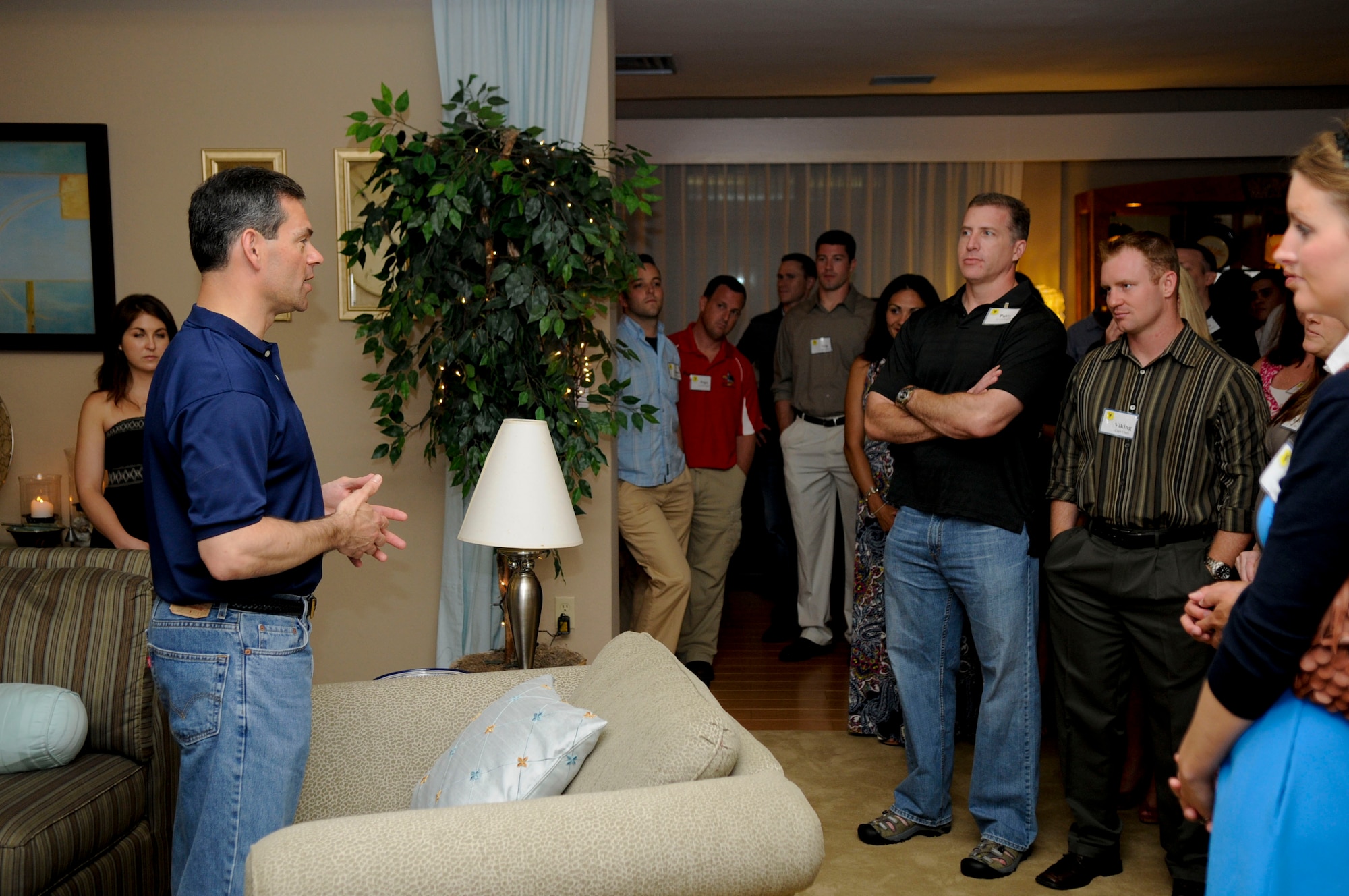 Brig. Gen. Ken Wilsbach, 18th Wing commander, gives a brief history on his home to guests at his “Sweet Sundays” social in his home, May 8. For nearly two years, Brig. Gen. Ken Wilsbach, 18th Wing commander, and his wife Cindy have been inviting Kadena’s many squadrons into their home Sunday evenings to socialize and share an assortment of Mrs. Wilsbach’s homemade desserts. Now, as his tour on Kadena comes to a close, the commander is meeting up with the last remaining squadrons this week. (U.S. Air Force photo/ Airman 1st Class Maeson L. Elleman)