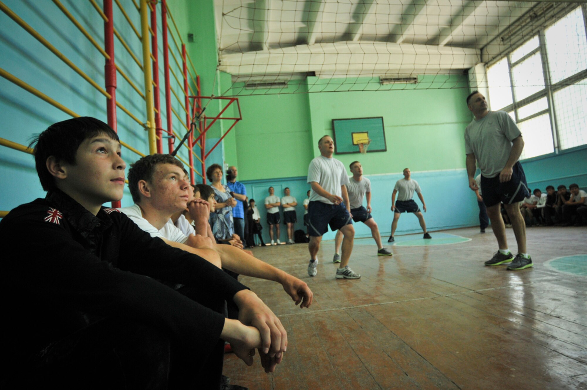 TRANSIT CENTER AT MANAS, Kyrgyzstan -- Transit Center Airmen participate in a friendly "Sports Day" competition with local school students in Sadove village May 9.  Days like this one spent developing teamwork and strengthening friendships through sports such as volleyball, basketball and soccer are a regular part of the Transit Center's outreach with local communities.  (U.S. Air Force photo by Staff Sgt. Stacy Moless)