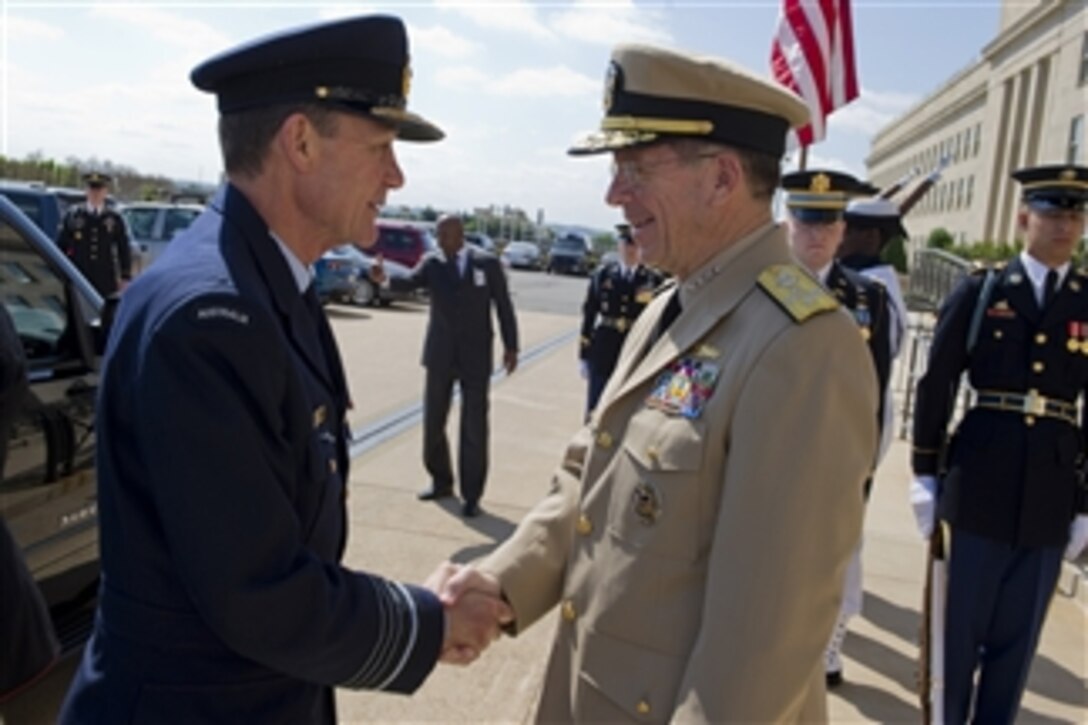 Chairman of the Joint Chiefs of Staff Adm. Mike Mullen, U.S. Navy, welcomes Australian Chief of Defense Force Air Chief Marshal Augus Houston to the Pentagon on May 11, 2011.  